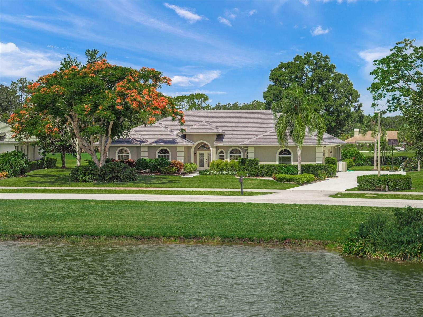 WELCOME TO LAUREL OAK ESTATES & COUNTRY CLUB, ONE OF THE MOST COVETED COUNTRY CLUB COMMUNITIES IN SARASOTA * This EXECUTIVE HOME BOASTS PANORAMIC VIEWS of a LARGE LAKE & GOLF COURSE * These are MUST SEE VIEWS * A very private setting that is perfectly positioned on OVER 1/2 ACRE * PRIDE OF OWNERSHIP SHOWS * Featuring 4 Bedrooms & 3.5 Full Baths * Formal Living Room and Formal Dining Room * This SPECTACULAR home has been LOVINGLY RENOVATED with custom and extensive upgrades opening up walls to give YOU the most open feeling with high ceilings and wood-like ceramic tile throughout * Take in the breathtaking views and sunsets of the pool and golf course from the living room, family room with full stone wall with a stone-framed accent wall with low profile electric fireplace and gourmet kitchen with pocket sliding doors perfect for entertaining or bringing the outside in! * Gourmet Kitchen complete with oversized island, WATERFALL quartzite counters, high-end stainless steel kitchen aid appliances including double wall oven/microwave, cooktop LED under cabinet lighting and wine fridge * All cabinetry was manufactured and installed by Italian Cabinetry, a premium high-end Miami cabinet maker * The master bedroom is generously sized with sitting area, 3 closets with built in shelving * Spa-like master bathroom complete with freestanding soaking tub, dual sinks and walk in shower. 2 bedrooms on opposite side of home each with walk in closets, one bedroom en-suite bathroom with door out to pool. 4th bedroom with en-suite 1/2 bath makes a perfect guest room or office. Extended laundry room just off the kitchen with extra counters/cabinet space and huge walk in pantry * Split Plan Design * Volume Ceilings * 8 foot Sliding Glass Doors with additional transom windows above * This IMMACULATE HOME has AN ABUNDANCE OF NATURAL LIGHT * All of this wraps your FANTASTIC OUTDOOR LIVING SPACE WITH A CAGED, HEATED POOL & SPA, 2 COVERED LANAIS, LARGE BACKYARD & CUSTOM LANDSCAPING * NEW TILE ROOF 2025 * 2 NEW A/Cs in 2017 & 2023 * Yard well for irrigation * OVERSIZED 3 Car Side Load Garage * This is the perfect home for entertaining or simply relaxing in your slice of paradise * A special opportunity behind the gates of Laurel Oak Estates, an outstanding Country Club community where nature and elegance abound. Offering 800+ acres of beauty and serenity, it is easy to see why some of the most discerning homeowners call Laurel Oak home. Optional club with outstanding facilities including 2 championship courses, 12 Har-Tru tennis courts, Junior Olympic-sized heated pool, & beautiful clubhouse, golf shop and attended locker rooms. Enjoy reciprocity with the Bird Key Yacht Club (boating, tennis, fitness, dining & social events) and quick easy access to I75, downtown, UTC Mall, World Famous Siesta Key beach and our other beautiful beaches * One look & you'll fall in love * Golf is optional, but if you want a golf membership, BUY THIS HOME AND GO TO THE FRONT OF THE LINE FOR A GOLF MEMBERSHIP. One look & you'll fall in love *