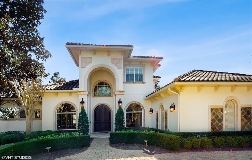 Residing in one of Winter Park’s most sought-after communities, this gorgeous Windsong Estate awaits. From the expansive layout and beautiful outdoor living space to the stunning Brazilian Walnut floors and detailed, high ceilings throughout the downstairs living areas, no aspect was overlooked in its construction or care since. The custom double entry doors and 19’ entry foyer welcome you into the formal living and dining, and flow into the remainder of the home. There are 5-bedrooms and 5-bathrooms (one being used as an office), a family room, formal living and dining rooms, bonus room, and a chef’s dream of a kitchen. Here you will find high-end Thermador, Monogram, and Bosch appliances, as well as custom cabinetry, granite counters, two large islands, breakfast bar, and walk-in pantry. The primary bedroom sits on the main level and is extremely spacious, offering a spa bath with dual vanities, large shower, soaking tub, and double walk-in closets with custom organizers. Upstairs is the bonus room along with 3 En-suite bedrooms, all quite spacious with large closets. Accessible from either the family room, formal living room, or primary bedroom to the outdoor living space is sure to be a favorite for everyone. The covered lanai boasts remote controlled screens, tongue and groove ceilings, tile floors, and a custom outdoor kitchen. All overlooking the custom pool by Southern Designs and lovely pond views. Community residents are zoned for A-rated schools and have access to 2 community pools, a splash park, playgrounds, and chain of lake access. With the recent price reduction, it is now the lowest priced home in Windsong Lakeside while enjoying a premium oversized, waterfront lot.