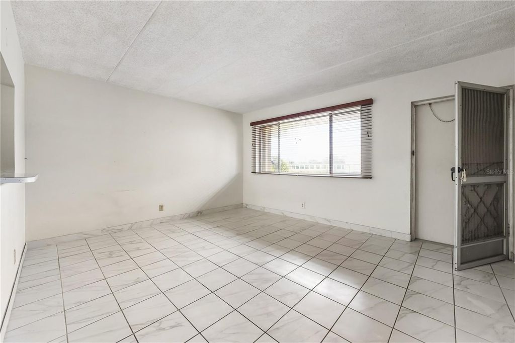 Photo of 400 Village Green Circle W #205, Palm Springs, FL 33461 (MLS # TB8454941)