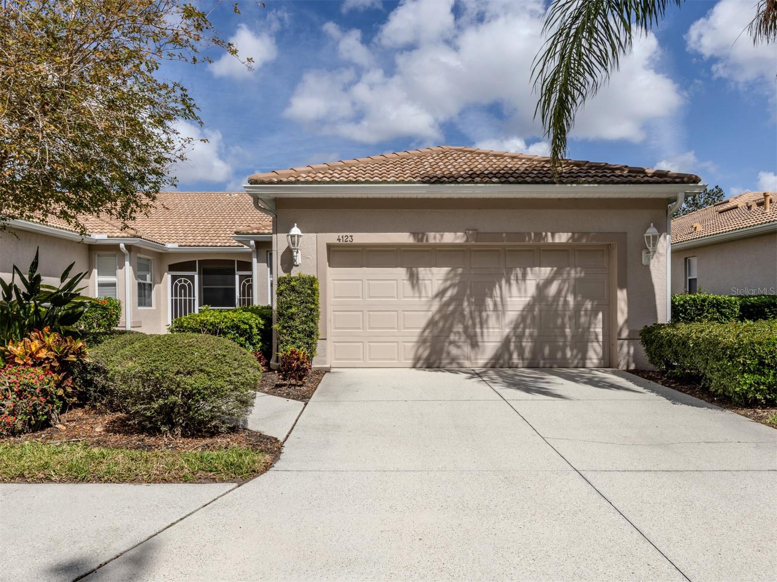 Welcome home to Lakeridge Falls, a Sarasota Gem! This end unit, 2 bedroom plus den home boasts extra square footage with the lanai space finished and fully air conditioned. The hurricane windows add additional security. The beautiful full lake view offers lots of nature and tranquility. Tile flooring in the main areas of the home give the home spaciousness and easy maintenance. The primary bedroom features an updated en-suite bath and walk-in closet. The second bedroom and guest bath are at the front of the home- offering privacy for guests. The kitchen has a convenient pass through window and breakfast area. The community of Lakeridge Falls offers a large range of amenities. The recreation and social center features a clubhouse which recently underwent a major renovation. The grand salon has been enlarged to accommodate large gatherings and meetings. The fitness center is located in a large space in the clubhouse. Immediately adjacent to the clubhouse is the pool annex building which now contains two billiards tables, a library and two computer stations with free Wi-Fi. Our outdoor amenities include a heated resort-style pool, spa, and two bocce ball courts. Our activities include a variety of card games like mahjong, poker, and bridge, bingo nights. Other activities include bocce, table tennis, yoga/stretch classes, as well as, water aerobics. There is even their own lakeside beach! The location is perfect! Close to dining, restaurants, SRQ and the University shopping complex. Soon to be open is the expansive Mote Marine Aquarium.