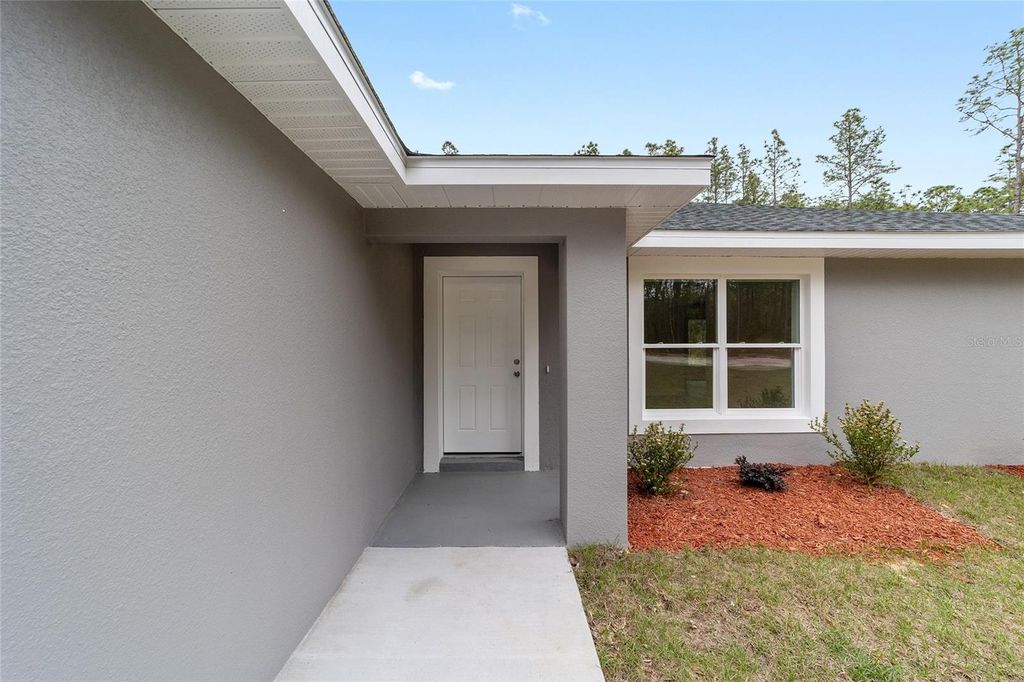 Photo of 1913 SW Deerpark Heights Road, Dunnellon, FL 34431 (MLS # OM720838)