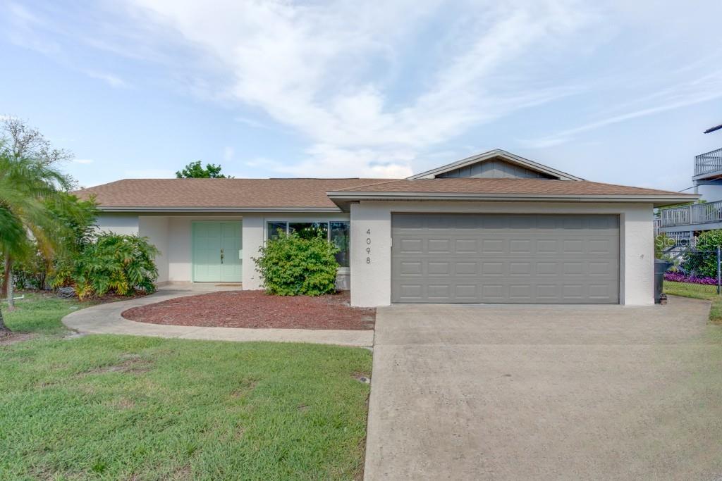 ZERO HISTORY OF FLOODING! WATERFRONT LIVING 9 FEET ABOVE SEA LEVEL! Welcome to your maritime sanctuary! This beautifully updated home, boasting 3 bedrooms, 2 full bathrooms and 1,960 square feet of solid block construction, is situated just seconds from the open Tampa Bay waters, making it a paradise for boaters and water lovers. Nestled in Coquina Key, this residence is only a short drive or bike ride away from the vibrant downtown St. Pete.
Step inside and immediately be greeted by stunning water views of the pool and canal from the living room sliders. The kitchen has been updated with quartz countertops, breakfast bar and casual dining area, offering more gorgeous water views. The chef in the house will love preparing meals while watching dolphins and manatees play in the water. This home features a split floor plan, an abundance of natural light, newer vinyl flooring, and a formal dining room.
The owner's suite is perfectly situated on the north end of the home, offering ultimate privacy. The suite features sliders opening to the pool area, a large walk-in closet, and an updated bathroom. The heated saltwater pool has just been resurfaced, and with the pool cage recently removed, the space feels open and inviting.
Perfect for boaters, the property offers a 10,000-pound boat lift and dock, equipped with fresh water and electricity. The 75-foot seawall, replaced in 2018, ensures longevity. Additionally, the home sits 9 feet above sea level and has never flooded.
Other highlights include PAID-OFF solar panels, a freshly painted exterior, a sandy waterfront beach area, 2018 hurricane-impact windows, a 2017 roof, new dining room light fixtures, updated ceiling fans in the guest bedrooms, and more. Conveniently located just 15 minutes from the gorgeous St. Pete Beach and only 5 minutes from grocery stores, museums, concert and sporting venues, and the trendy restaurants of thriving downtown St. Pete, where coastal charm meets easy access to all that St. Pete delivers. Start living the good life and come see this incredible home today!