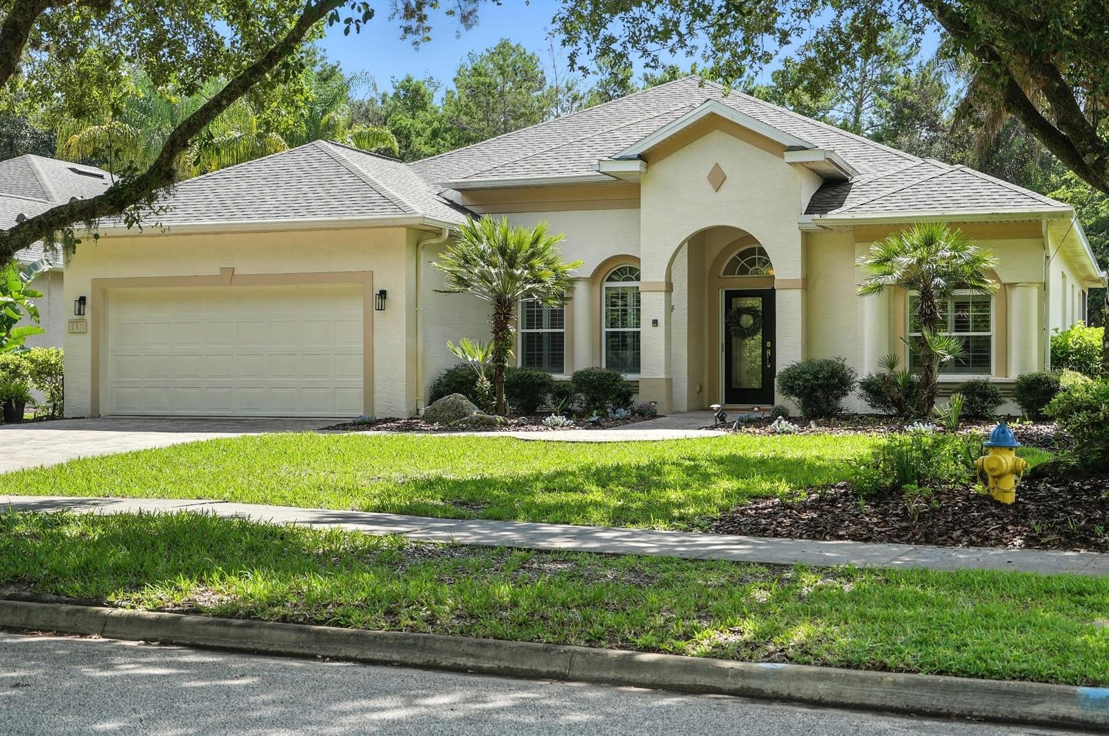 Welcome to your dream home in the highly sought-after Halifax Plantation! This pristine 3-bedroom, 2-bathroom ranch with an office/flex space offers 2,288 sq ft of thoughtfully designed living space on a spacious 0.29-acre lot. Featuring soaring 9+ foot ceilings, a brand-new roof, fresh paint, and new carpet throughout, this home is move-in ready. The open concept, floor plan creates effortless flow, while the custom kitchen boasts granite countertops, stainless steel appliances, high-end cabinetry, a center island, and abundant storage. Step out to the fully screened 330 sq ft paved patio — the perfect place to unwind while overlooking the peaceful conservation area. The expansive backyard offers plenty of space to add a pool and create your own private oasis. Retreat to a luxurious primary suite complete with patio access, dual vanities, a garden tub, walk-in shower, and an oversized walk-in closet. A paved driveway and manicured landscaping complete the curb appeal. Located in Halifax Plantation — a vibrant community with a golf course, restaurant, and clubhouse open to the public. Optional membership amenities include tennis, pool, and fitness center. Minutes to Publix, the beach, and intercoastal waterways! All information taken from tax record, and while deemed reliable, cannot be guaranteed.