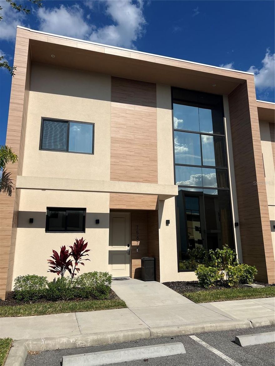 Stunning fully furnished 4BD/5BA townhouse just steps from the clubhouse and near the main entrance of Magic Village View. Ideal for investment or personal use. Features gourmet kitchen, full laundry, and extended outdoor patio with summer kitchen and spa. Located only 5–10 minutes from Disney parks and surrounded by restaurants and supermarkets. Enjoy resort-style living with 24/7 clubhouse, fitness center, concierge, restaurant, and strong short-term rental potential.