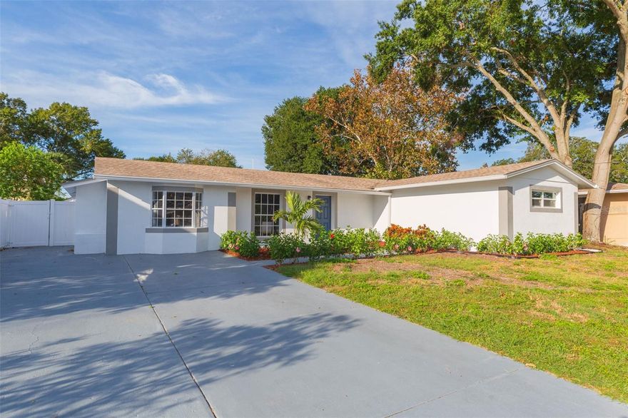 Welcome to this beautifully renovated 4 bedroom, 3 bathroom gem that epitomizes modern comfort and convenience. Located just 8 minutes from Tampa International Airport and a mere 15 minutes from the vibrant heart of Downtown Tampa, this is a property that redefines the essence of Florida living.This home underwent an extensive renovation, ensuring that it shines like new. The updates include a 2019 roof, 2023 A/C, an updated electrical panel, and all-new plumbing. You can move in with peace of mind, knowing that the infrastructure is in excellent condition. 90% of the windows in this home are new Impact rated windows, providing energy efficiency and hurricane protection. Safety and comfort go hand in hand. The kitchen is a chef's dream, boasting solid wood high gloss cabinetry, stunning quartz countertops, and top-of-the-line stainless steel appliances. It's the perfect space for creating culinary masterpieces or simply enjoying family meals. The waterproof laminate flooring throughout adds both style and durability to the home. It's easy to maintain and stands up to the demands of everyday life. With 4 spacious bedrooms and 3 beautifully updated bathrooms, there's plenty of room for family, guests, or even a home office. The open floor plan creates a sense of airiness and flow, making this home perfect for both entertaining and everyday living. Beyond the front door, this community offers a private boat ramp, providing direct access to the stunning Tampa Bay. Whether you're a boating enthusiast or simply seeking to explore the beautiful waterways, this feature is a significant advantage. With endless reasons to make this house your forever home, don't miss the opportunity to own a piece of Tampa's finest real estate. This property has been thoughtfully updated, combining modern amenities with timeless elegance. Schedule your showing today, and make this dream home yours!