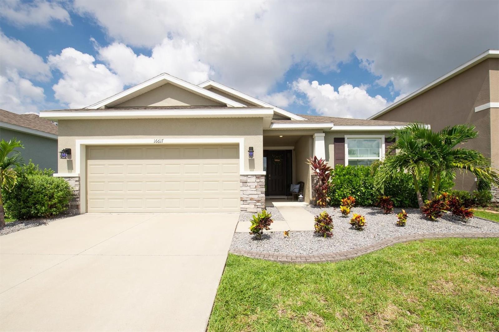 Enjoy RESORT STYLE LIVING in the established GATED COMMUNITY of Southshore Bay! Presenting nearly 2,000 sprawling square feet, this GORGEOUS concrete block home, LOCATED ON A CUL-DE-SAC, welcomes you to open concept living perfect for any lifestyle! Built in 2020, you will find all the newer benefits of comfort and fun including a SMART HOME package in an ULTRAFi community hosting ultra-speed Wi-Fi throughout - CABLE AND INTERNET ARE INCLUDED IN THE LOW HOA FEE reducing your monthly bills even MORE! Step into the oversized foyer to find tall ceilings and a bright, airy design. The kitchen is well-appointed with GRANITE COUNTEROPS, COMPLETE STAINLESS STEEL APPLIANCE PACKAGE, and an OVERSIZED CENTRAL ISLAND with breakfast bar and eat-in dining space. The large primary retreat with WALK IN CLOSET and tons of natural light make for the perfect place to rest and relax while the primary EN-SUITE offers comfort and elegance with dual sinks, GRANITE countertops, walk-in shower, GARDEN TUB FOR SOAKING, and separate water closet. A true split floor plan, this home is perfect for a variety of living and guest arrangements. The spacious 2nd and 3rd bedrooms are located opposite the primary bedroom giving an added sense of privacy. INTERIOR LAUNDRY ROOM and an attached 2-car garage with shelving / storage features allow for extra convenience. The outdoor living possibilities are endless here! Situated on a PREMIUM LOT, you will find extra space. Take advantage of all seasons with a larger backyard and the COVERED, ENCLOSED LANAI which comes pre-wired for all of the outdoor entertainment options you have been dreaming of! With tons of EXTRAS, this home comes with upgraded landscaping, energy-saving features, and SMART TECHNOLOGY. Southshore Bay residents can take advantage of the paradise-like neighborhood featuring the world’s top amenity: a multi-acre CRYSTAL LAGOON with a swim-up bar and restaurant for endless fun that lets you live like you are on vacation! Cabanas, sandy beach areas, a playground, dog park, zen garden, walking trails, golf cart paths and more! Meet friends and neighbors easily at one of the many community events and celebrations. Commuting is easy with access to major roads and highways. Downtown Tampa is less than 30 minutes away while Tampa International Airport, MacDill Air Force Base, highly esteemed colleges and universities, a newly built VA Medical Center, state-of-the-art health care, world-champion sports leagues, magical theme parks and world-famous beaches, museums and nature preserves are all just an easy car ride away. Take advantage of this Florida lifestyle in a GORGEOUS, like-new home ready NOW…WELCOME HOME!