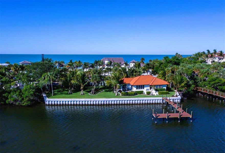 This bayfront cottage on Casey Key offers a tranquil island escape with panoramic views of Blackburn Bay, lush landscaping, and indoor-outdoor living from a coral-stone patio or spacious waterside lawn. It features over 200 feet of new seawall and dock, ideal for boaters. With no nearby neighbors, it offers ultimate privacy. The low-density development of the island ensures a peaceful setting, yet it’s conveniently located near Sarasota and Venice Island, with easy access to beaches, restaurants, and cultural attractions. Perfect as a winter getaway or year-round home.