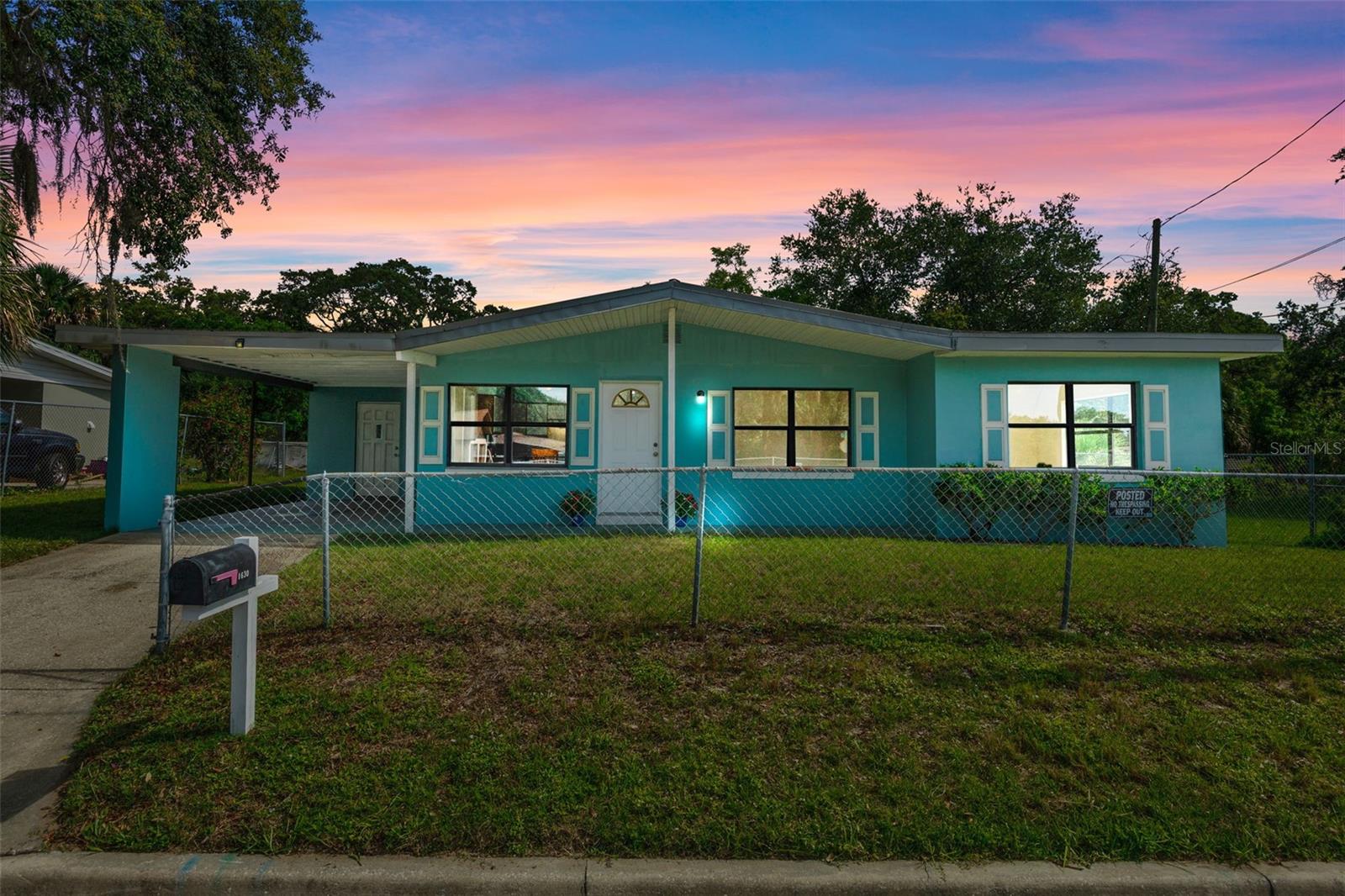 This refreshed MOVE-IN Ready CONCRETE BLOCK home with NO HOA reflects the care and pride of a longtime owner combining classic style with upgrades. Step inside to find easy-maintenance CERAMIC TILE FLOORING throughout and a LIGHT- FILLED Florida room framed by large corner windows. The spacious layout feels airy and welcoming. FLORIDA ROOM W/ EXTERIOR PRIVATE ENTRANCE can be enclosed to create a 4th bedroom w/own ENTRANCE. The kitchen features STONE-LOOK COUNTERS, GLASS-TOP RANGE, stainless steel sink, and plenty of prep space. Primary bath has been tastefully refreshed— by a rich, solid wood vanity, tan granite countertop, & brass fixtures. FENCED LARGE BACKYARD offers plenty of space & with NO SIDE NEIGHBOR the OPEN LOT NEXT Door offers privacy. Enjoy the benefits of major system upgrades, including a LIFETIME METAL ROOF, TRANE Ameristar CENTRAL AC with optional Wifi. TRUSSED Carport can be enclosed for added sq ft & Utility Room off carport with Washer/Dryer Hookup & Sink.