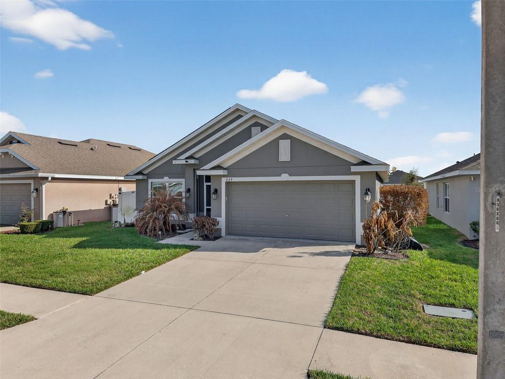 Photo of 649 Meadow Pointe Drive, Haines City, FL 33844 (MLS # S5145605)