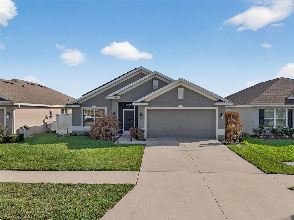 Photo of 649 Meadow Pointe Drive, Haines City, FL 33844 (MLS # S5145605)