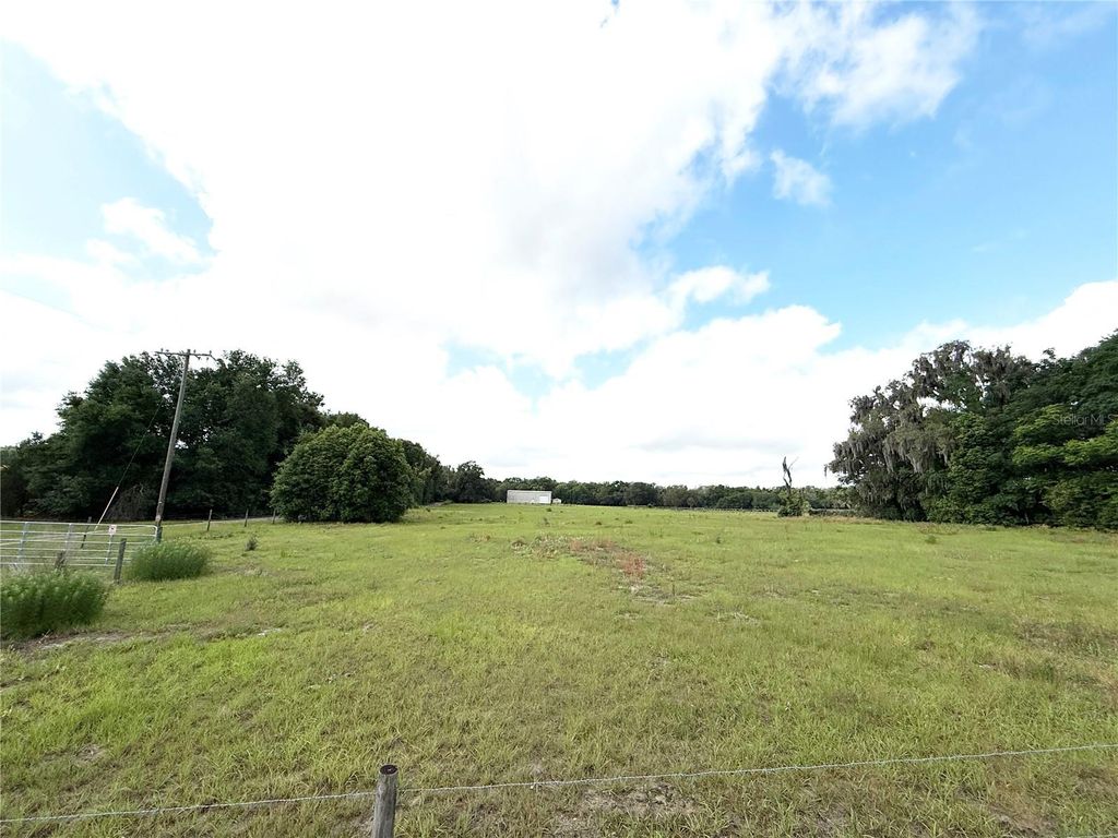 Photo of SE Sunset Harbor Road, Weirsdale, FL 32195 (MLS # OM724719)