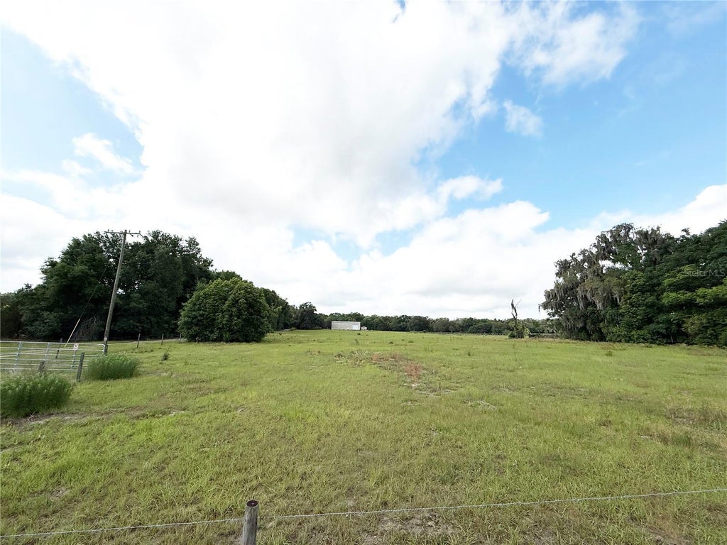 Photo of SE Sunset Harbor Road, Weirsdale, FL 32195 (MLS # OM724719)