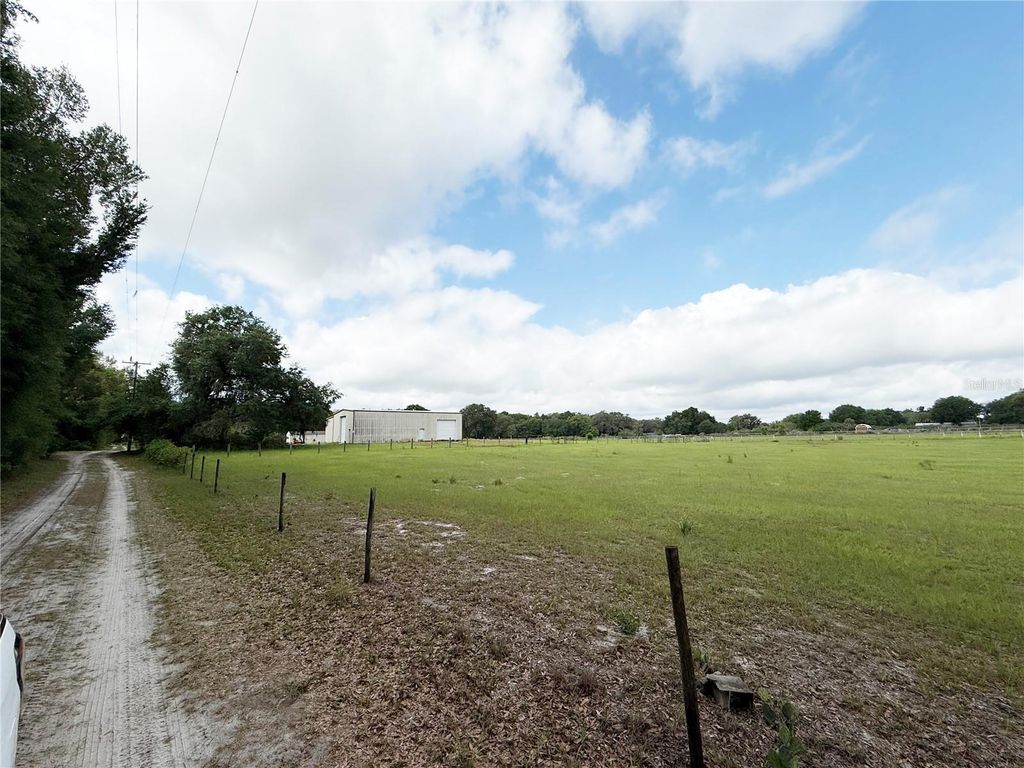 Photo of SE Sunset Harbor Road, Weirsdale, FL 32195 (MLS # OM724719)
