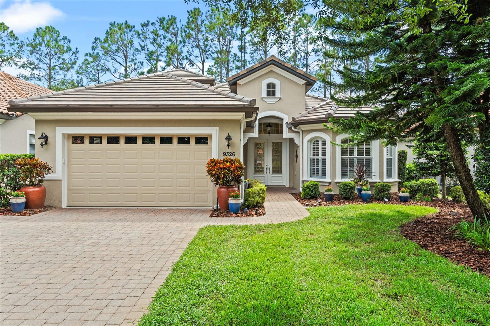 Enjoy the quiet but active lifestyle at Las Colinas in the Mission Inn Resort and Club! Fine restaurants, two championship golf courses, tennis courts, pickleball courts, spa, skeet and trap, and more await you in the quaint town of Howey-in-the-Hills. This home overlooks a beautiful pond and the golf course, and features a BRAND NEW $60,000 flat tile roof, an incredible added value and peace of mind for the new owner. The beautiful home has been meticulously maintained with upgraded appliances, built-ins in every closet, crown molding, and stylish lighting fixtures. Downstairs bedrooms and the den/office showcase rich wood floors, while the spacious en suite master bedroom offers walk-in closets, a soaking tub with separate shower, and dual sinks. The gourmet kitchen delights with wood cabinets, quartz countertops, farmhouse stainless steel sink, and a built-in pantry storage, all centered around a sit-down island bar. A large dining room provides plenty of space for entertaining, and the built-in entertainment center features a gas fireplace, display shelving, space for an enclosed TV, and storage. Upstairs, a spacious bedroom/bonus room with its own air conditioner and half bath can flex as a theater room, home office, craft room, or more. Plantation shutters and window treatments enhance the home throughout. Outdoors, you’ll enjoy many hours on the expansive patio, with covered and screened sections perfect for year-round entertaining. A large gas fireplace makes cool evenings especially inviting. Mature landscaping adds both beauty and privacy. Beyond the home, you’ll have access to the marina on the Harris Chain of Lakes for boating or bass fishing adventures. This home is truly ready for you to enjoy. Membership initiation fee to Mission Inn Resort and Club is required with this home. Inquire for more details.