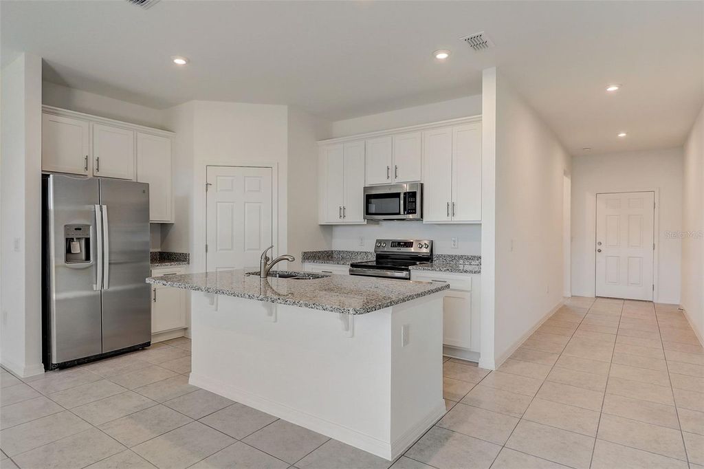 Photo of 9221 Harris Hawk Drive, Leesburg, FL 34788 (MLS # O6405947)