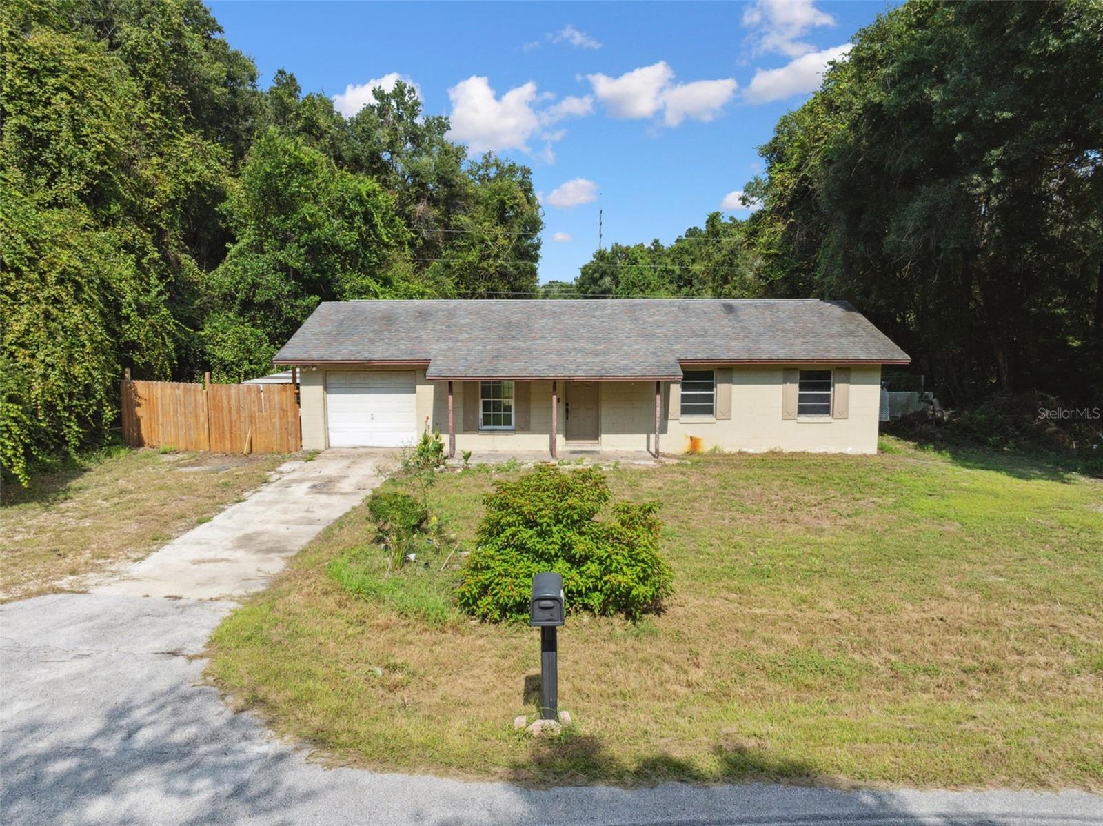 Short Sale. This Inverness gem is a diamond in the rough! Have you ever watched HGTV and thought, “I can do this”? If so, break out your toolbelt and measuring tape, because you need to see this adorable Inverness home! It’s tucked away in a lovely rural neighborhood with no HOA or deed restrictions, and it has off-the-charts potential for a savvy investor. Let’s talk positives: the floor plan is open and spacious with laminate flooring throughout. The kitchen is modest, but functional with plenty of cabinet space for storage. All three bedrooms are sizable, and the primary bedroom has an attached bath with a large shower. Double French doors in the dining room lead to a big backyard. There is currently a large dog kennel that wraps around to the side of the house, but it could be removed to expand the available yard space. With a central location between US-41 and SR-44, you’ll have easy access to downtown Inverness, Crystal River, Citrus Springs, Dunellon, Brooksville, and Tampa. Outdoor enthusiasts might enjoy its proximity to the Citrus Wildlife Management Area and the Tsala Apopka Lake system. It’s also less than 15 minutes away from the Withlacoochee State Trail, one of the longest paved rail-trails in Florida, and very popular with walkers, runners, bikers, skaters, and more. Private tours are available. With a plan, some work, and a lot of love, this caterpillar could become a beautiful butterfly - and someone’s dream home. See it today!