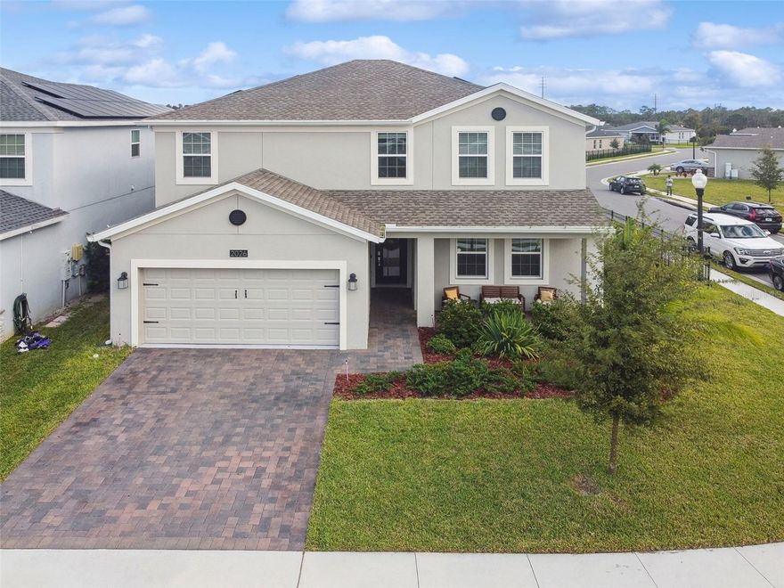 Welcome to your dream home built in 2021 on a large corner lot! This 5 bedroom, 3.5 bathroom, 3,301 sq ft exceptional two-story residence offers a Next-Generation living experience like no other. Providence Camden Park is a solar-powered and resort-style golf course community situated in fantastic Davenport, FL, just outside the Orlando area. This home boasts a unique attached private suite with its own separate entrance, providing versatility and comfort for multi-generational living or guest accommodations. The private suite features a spacious living room, a charming breakfast nook, a kitchenette equipped with appliances for light cooking, laundry closet, a cozy bedroom retreat, and a full bathroom with a walk-in shower. The main home first floor highlights an open-concept living space, seamlessly connecting the living room, dining area, and kitchen.  It’s an ideal layout for gatherings and socializing with friends and family. Upstairs, you’ll find four generously sized bedrooms and a versatile loft space that can be transformed into a home office, play area, or a cozy reading nook.  The master suite offers an abundance of space which connects to an en-suite bathroom, complete with double sinks, a garden tub, a separate shower, and a walk-in closet. The other three bedrooms and full bathroom features double sinks and a tub/shower combo. Additional updates/features include upgraded tile flooring for entire first floor, glass front door, rod iron staircase, GE water filter/softener, fencing, additional insulation and a second layer of drywall between the private suite master bedroom and the family room, upstairs laundry room, and a tandem garage that can accommodate 3 cars.  As a resident of Providence, you’ll have exclusive access to the golf course (additional fee required), clubhouse with restaurant & bar, aquatic center with resort style pool with slides & lap pool, lighted tennis courts, fitness center for aerobics classes & karate, 24-hour manned gatehouse, dog park, wide sidewalks for bicycling, joggings, and walking to the golf and recreation center. Only 30 minutes away are Orlando’s metropolitan area and Disney World. *Buyer to assume solar lease of $95.00 per month*