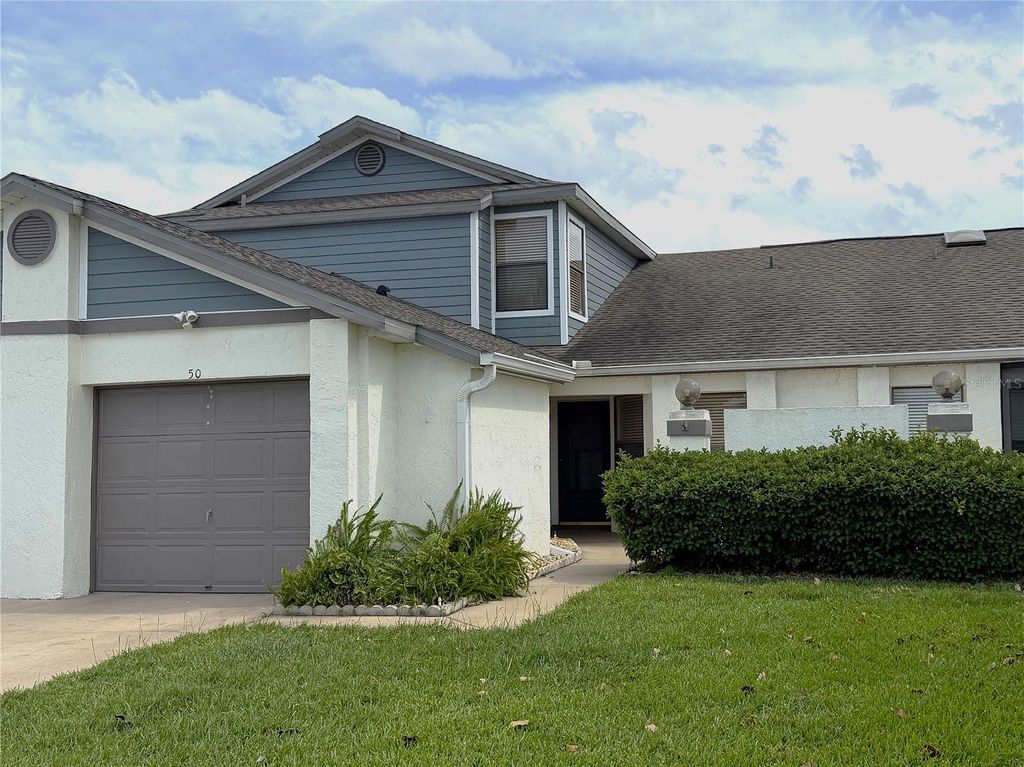 Photo of 50 Lakepointe Circle, Kissimmee, FL 34743 (MLS # O6401506)