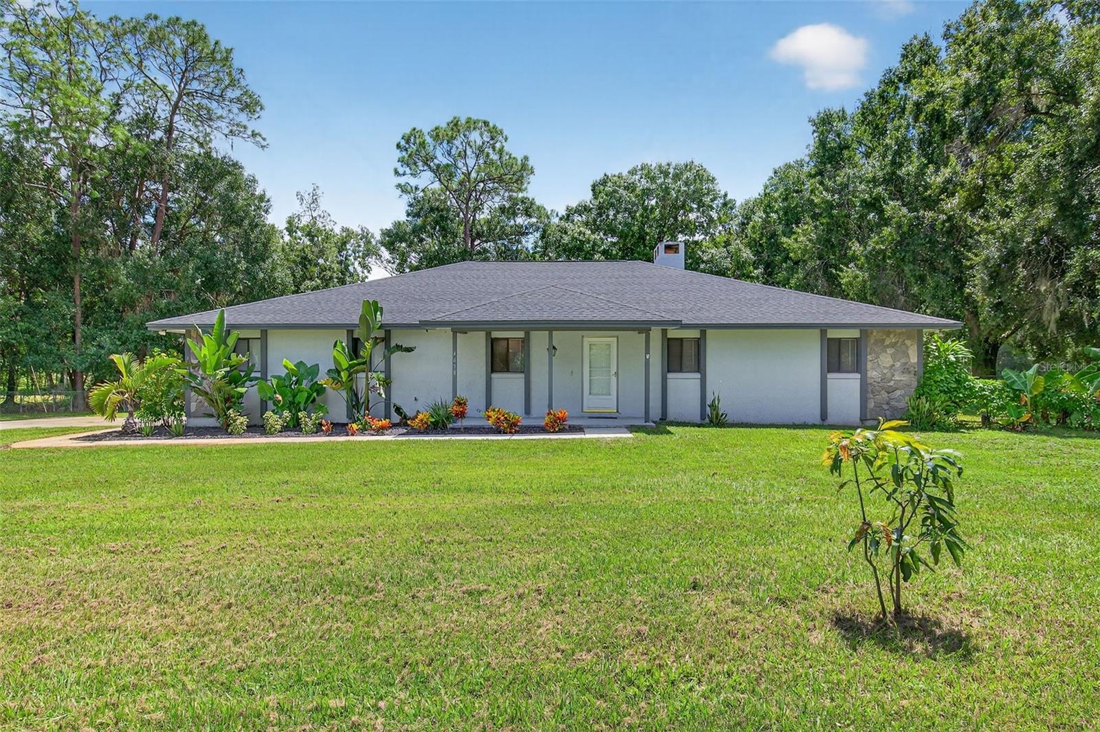 Welcome to 4618 Deeson Road, a hidden gem where your family can spread out, grow, and thrive. This 3-bedroom, 2-bathroom home blends comfort with country charm, offering the perfect setting for a lifestyle with more space and freedom.
Inside, a cozy fireplace anchors the living room, while a gorgeous sunroom with oversized windows fills the home with natural light and peaceful views of your land. Step outside to enjoy true Florida living with your own in-ground pool, ideal for hot summer days.
On nearly 3.75 acres, there’s room to raise chickens, livestock, or even horses—the property is zoned for them! A private road leads to your driveway, giving you the peace and privacy you’ve been searching for. Already planted are grapevines, passion fruit, guava, and a mango tree, ready for you to enjoy fresh harvests from your backyard.
Whether you’re looking to create a mini homestead or simply want more room to run and play, this property delivers it all.
