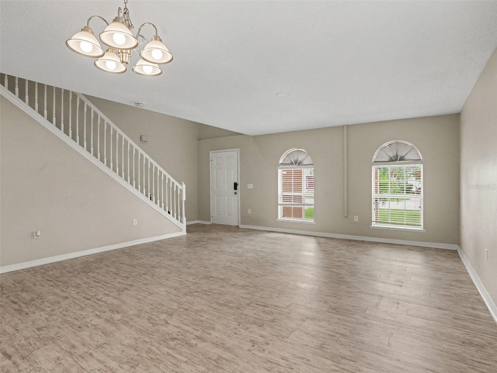 Photo of 829 Sun Ridge Village Drive, Winter Haven, FL 33880 (MLS # O6447971)