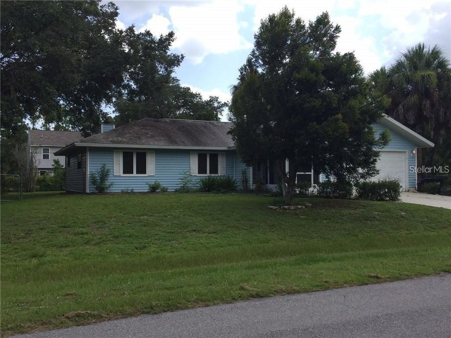 This three bedroom home has a large fenced yard on two lots.  The home features a living room and a family room with a fireplace and a two car garage.  Call today for an appointment