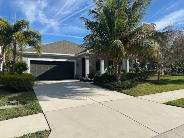 Welcome to this stunning modern home located at 5262 Asher Ct, Sarasota, FL. Built in 2018, this single-family home boasts a sleek and contemporary design with high-end finishes throughout. With 4 bedrooms, 3 bathrooms, an attached two car garage, and a spacious 2,307 sq.ft. of finished living space, this property located on street ending in a cul de sac offers plenty of room for comfortable living. Upon entering the home, you are greeted by an open-concept layout that is ideal for entertaining and everyday living. The main living area features high ceilings, large windows that allow for plenty of natural light, and stylish tile flooring. The gourmet kitchen is a chef's dream, with stainless steel appliances, quartz counter tops, and a large center island for meal prep and casual dining. The house is fully equipped with recently purchased upscale furnishings including but not limited to two elegant leather couches, a full office set, a grand dining table, and four large, high quality flat screens. The master suite is a true retreat, with a spacious bedroom, walk-in closet, and a luxurious en-suite bathroom featuring a dual vanity, soaking tub, and separate shower. Outside, a covered lanai provides the perfect spot for al fresco dining or relaxing with a morning cup of coffee. The lanai presents an immaculately landscaped expansive back yard featuring native plants such as bougainvillea, banana trees, lady finger, sable, coconut, paurotis, and Chinese fan palms, as well as a high-end privacy fence and underground irrigation system. The property sits on a sizable lot with a total of 7,822 sq.ft., offering plenty of outdoor space for gardening, playing, or simply enjoying the Florida sunshine. Located only 6 miles from the heart of downtown Sarasota and 4 miles from the famous Bobby Jones golf course this house is advantageously positioned to take advantage of Sarasota’s most desired beaches, restaurants, shopping and cultural attractions. Palmer Park HOA features 35 homes in a neighborhood located in a peaceful nook west of Honore Avenue just north of the western end of Palmer Boulevard. It is flanked north by the older, 255-home community of Cedar Hollow and south by Sunnyside Village, a senior Christian living community of some 200 residences off Bahia Street. The HOA services include lawn and shrub maintenance. Don't miss your chance to own this exquisite home in Sarasota, FL. Schedule a showing today and experience the beauty and elegance of 5262 Asher Ct for yourself. The parcel has recently been surveyed, a title commit completed, and an Estoppel Certificate performed.