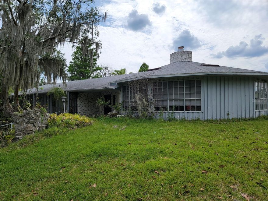 Short Sale. Short Sale!!!  Investor opportunity with endless potential on Little Lake Victoria! This rare short sale property sits on 1.68 secluded acres in South Lakeland on a private peninsula with water on three sides, offering breathtaking lake views from nearly every room. If you’ve been searching for a one-of-a-kind waterfront estate to renovate and transform into something spectacular, this is it.  The main home features 4 bedrooms and 3 bathrooms, including a private 4th bedroom suite located off the garage with its own entrance and bathroom — ideal for an older child wanting independence, guests, a home office, or multigenerational living. While the home needs significant updating and repairs, the setting and layout offers incredible possibilities for the right buyer with vision.  Adding even more value and opportunity is the detached 2 bedroom, 2 bathroom cottage located on the property. The cottage is currently not livable after sustaining major roof damage during the last hurricane, but the potential is undeniable. With extensive renovation, it could become an income-producing rental, AirBnB, guest house, or the perfect detached in-law home for an amazing family compound.  Important updates already completed on the main home include a new roof, septic system, and drainfield in 2020, along with a new AC in 2017.  This property is being sold as a short sale and will require lender approval. The listed price is not guaranteed to be the final accepted sales price. Buyers should expect a lender response time of approximately 60–90 days. Cash offers only due to the condition of the property.  Bring your vision, roll up your sleeves, and look beyond the tall grass and deferred maintenance — because this hidden waterfront estate could truly become paradise once again.  NO SITE UNSEEN OFFERS WILL BE CONSIDERED!