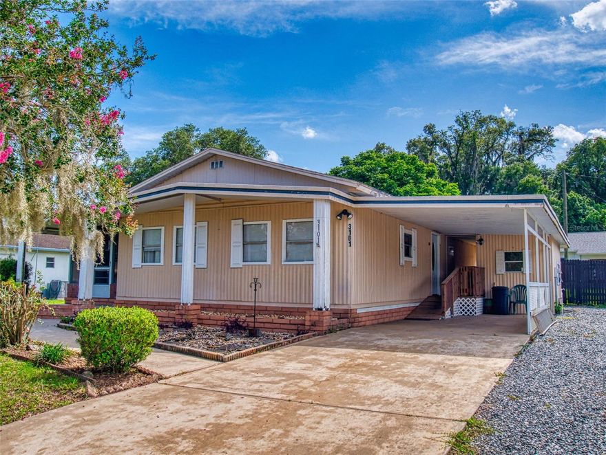 Welcome to Oak Park Village! This two-bedroom, two-bathroom home features, new paneling throughout, offering a fresh, updated look to its inviting interior. Just minutes from historic downtown Ocala, the property enjoys close proximity to charming shops, local dining, medical centers, and entertainment venues. With easy access to Interstate 75, travel throughout Central Florida is a breeze.

Inside, the open-concept layout is enhanced by engineered hardwood floors and abundant natural light. The kitchen provides generous storage and workspace, ideal for everyday cooking or hosting. A newly installed ramped entry ensures smooth accessibility throughout the home.

Situated on a private 0.23-acre lot, the fully fenced yard offers space for pets, gardening, or outdoor gatherings. The enclosed lanai with large windows creates a comfortable indoor-outdoor retreat, perfect for year-round enjoyment.

No HOA—and you own the land, a rare find in an established community. Enjoy the simplicity of public water and sewer, not having a well or septic to maintain. All ages are welcome, and the property presents strong income potential as a rental or a great primary residence.

Whether you're a first-time buyer, downsizer, or investor, this home offers convenience, comfort, and opportunity. Schedule your private showing through Showingtime and explore the interactive 3D tour to experience everything this property provides.