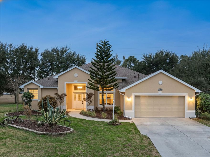 One or more photo(s) has been virtually staged. Welcome Home to This COMPLETELY RENOVATED, MOVE-IN READY Gem on Over ¼ Acre in Legacy of Leesburg! Perfectly positioned on a quiet cul-de-sac and just walking distance to the Legacy clubhouse, this beautifully updated home offers rare privacy, modern luxury, and an unbeatable location within the community. Set on over ¼ acre, the property is surrounded by peaceful private tree views from nearly every window, creating a serene backdrop with plenty of room to add a pool if desired. Step inside and immediately notice the soaring ceilings, open floorplan, and brand-new Luxury Vinyl Plank flooring (2025) throughout the main living areas. The home has been completely refreshed with new interior paint (2025), designer lighting fixtures, and modern pendant lighting (2025), creating a bright, elevated feel throughout. The fully renovated luxury kitchen (2025) is stunning and functional, featuring: Brand-new cabinetry, Quartz countertops, Designer backsplash, New stainless steel appliances (2025), & Refrigerator (2024). The open layout flows seamlessly into the living space, highlighted by a custom accent wall, making the main living area feel stylish and inviting.The primary suite has been completely transformed (2025) into a spa-like retreat, featuring a beautifully renovated bathroom with a separate soaking tub and walk-in shower, updated vanities, and refined finishes. Every detail feels fresh, modern, and thoughtfully designed. Additional major upgrades include: Roof (2021), Brand-New AC (2025), Brand-New Water Heater (2025), Washer & Dryer (2025). Enjoy Florida living at its best from your large screened-in lanai, overlooking peaceful, private views - no rear neighbors, just nature and tranquility. Located in the highly desirable 55+ community of Legacy of Leesburg, residents enjoy a resort-style pool, fitness center, walking trails, tennis, pickleball, softball, clubhouse activities, and more - with low HOA fees that include lawn care, cable, and internet. If you are searching for the best luxury upgrades, complete renovation, privacy, and true move-in ready condition - this is "THE ONE"!