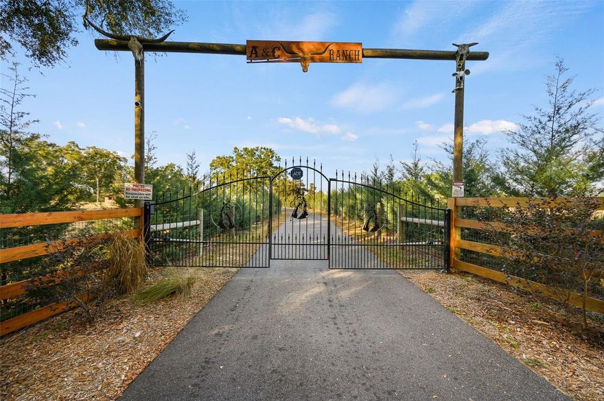 A slice of heaven in the country! Look no further!
 Escape to the serenity of country living on this stunning 19.6-acre Farm Retreat Estate surrounded by mature foliage and natural Florida beauty. A paved circular driveway welcomes you through a wrought iron gated entrance, beautifully lined with 
N C Sapphire trees for a grand approach. The property is fully fenced with 6ft fencing. and offers multiple pastures for horses or livestock, and gated passageways between the three individual parcels for convenience and for your protection, security cameras surround the property with motion detection lighting throughout the grounds.
This well-planned farm includes a 3 stall stable, a large equipment barn with power, ideal for storing tractors, vehicles, or boats. Includes full RV hookup and a separate 56’x26’ garage with additional well, septic, and plumbed to add an additional bathroom and shower and storage shed. Full irrigation system throughout the acreage ensure easy maintenance and functionality for any agricultural or recreational pursuits. This property is equipped for both comfort and practicality, the estate features a three-car detached carport with a metal roof, a stable, a large pole barn with power for tractors, boats, or recreational vehicles, and an additional storage shed for multiple usage.
The property also features a customized 2023, spacious 2-bedroom, 2-bath upgraded customized double-wide mobile home with a metal roof, gutters, and downspouts complete with wooden beams and hardwood trim, luxury vinyl plank flooring and ceiling fans with ample lighting throughout the home. This 2,280 sq ft home is well insulated and customized with many upgrades and beautifully designed living space with new Hardi-Plank siding. Inside, you will find a chef-inspired kitchen with granite countertops, ample cabinetry, a center island, a gas stove, and upgraded appliances, and pantry. The spacious master suite boasts a luxurious bathroom, complete with an on-demand hot water system and an impressive walk-in closet, while the guest bedroom is equally comfortable and inviting.
Enjoy the tranquility of nature from your covered and screened back porch or unwind in the salt water system hot tub after a long day. Every detail was thoughtfully planned to accommodate a couple or family looking for their dream home in the country, where peace, privacy, and the sounds of nature surround the you. 
For the gardener in the family, this property is truly a treasure. It features a stunning collection of established plants that have bloomed for generations—brought from beloved homesites over the years. Enjoy the beauty of canna lilies, camellias, azaleas, hollies, elephant ears, crepe myrtles, berry bushes, and majestic grand oak trees, and so much more, complete with an irrigation system.  Each season brings new color and charm, offering endless joy as the gardens come to life year after year.
Whether your dream of creating a working farm with cattle, or harvesting hay, with a private equestrian retreat, or simply your own quiet piece of  Florida Paradise Country Living, this rare property offers endless possibilities.
Conveniently located on a paved road in Alachua County, this property offers easy access to local shopping, dining, charming local towns, world-renowned freshwater springs, many recreational facilities, and the I-75 corridor.
 Call today to schedule your private showing!