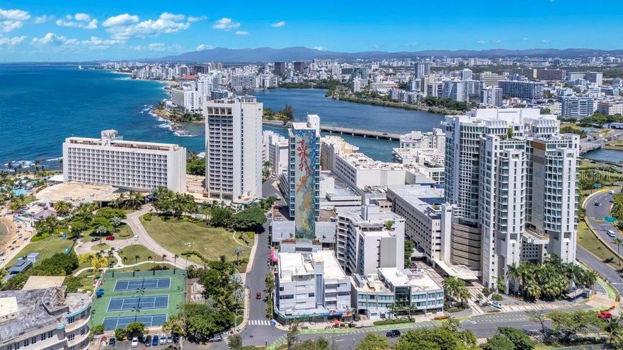 Multi-Family and Commercial Corner Property 51 Muñoz Rivera Ave., corner of Los Rosales St. and Las Palmeras St., San Juan, P.R. 00901 Lot Size: 1,639.04 sq. mts. Total Built Area: 26,254 sq. ft. Commercial Retail Spaces: 8 Residential Units: 26 Parking Spaces: 18 Zoning: CT-1, Commercial Tourist Year Built: 1955 Type: Mixed-use Commercial / Residential Corner Property Facing the Caribe Hilton Hotel This property spanning almost a block, consists of two corner buildings totaling 26 apartments, 8 commercial units, 18 parking spaces, and two rooftops with sweeping views. It is the last available mixed-use property of its kind in the Caribe Hilton corridor—an area known for its iconic destinations, direct waterfront access, and steady visitor traffic. With a 1,639-square-meter lot and 26,254 square feet of built area, this corner parcel with triple frontage presents an exceptional investment opportunity in one of San Juan’s most strategic and high-demand locations. A Coveted Location with Proximity to some of San Juan’s Iconic Sites Located along San Juan’s scenic coastal gateway—just minutes from the cruise ship port, historic Old San Juan, upscale condominiums, luxury beachfront hotels, the Convention District, El Distrito T-Mobile, marinas, and the regional private aviation airport—this property is ideally positioned to attract both locals and tourists. Directly facing the iconic Caribe Hilton, the legendary Normandie Hotel, and Puerto Rico’s Supreme Court, the property boasts a location that is both strategic and symbolic. Just steps from El Escambrón Beach—known for its calm, reef-protected waters ideal for swimming, snorkeling, and scuba diving—and a short walk from Luis Muñoz Rivera Park, a lush 12-acre green space. Positioned between Old San Juan and Condado—Puerto Rico’s most emblematic districts—this site serves as a threshold between the timeless character of the old city and the contemporary sophistication of San Juan’s luxury district. Zoning: Commercial Tourist (CT-1) CT-1 (Comercial Turístico 1) zoning allows for a broad range of tourism, hospitality, and commercial uses—such as boutique hotels, short-term rentals, restaurants, or mixed-use redevelopment—especially in high-traffic, visitor-oriented areas like this dynamic coastal corridor. Location, location, location—at its finest. Opportunities like this do not last. Be the one to claim it.