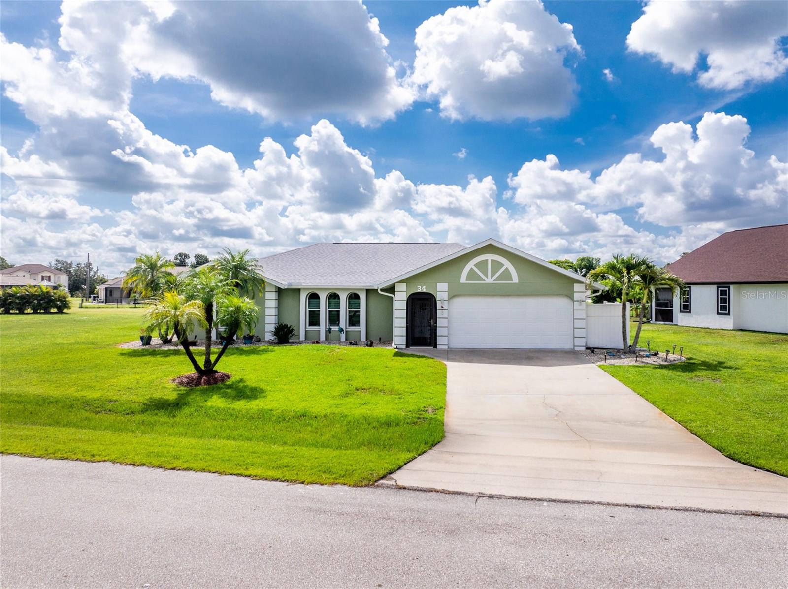 Impressive 3 Bedroom, 2 Bathroom home with attached 2 Car Garage located in the desirable deed restricted community of DEEP CREEK. This home is located on an oversized lot in a quiet neighborhood on a dead end street just before the cul-de-sac. This light and bright home offers a Living Room, separate Dining Room, Family Room, well equipped Kitchen, Inside Laundry and screened Lanai. The Living room features laminate flooring, 3 large arched windows and cathedral ceiling. The Dining room has sliding glass doors to the Lanai. The Family Room has a vaulted ceiling, plant shelves and laminate flooring. The Kitchen features white cabinetry, granite counters, tile backsplash, dining area and pass thru to the Lanai. Appliances include double door Refrigerator, oven /range, microwave dishwasher. The Inside Laundry has a washer and dryer. The spacious Master Bedroom suite has a walk in closet, lanai access and private bathroom with his and hers sinks and large walk in shower. There are two generous guest bedrooms with walk in closets and the guest bathroom has a tub/ shower combo. Your living space extends to the 18x17 screened lanai with large covered area and Greenbelt view. Other features include screened front entry, arched doorways, pocket sliders, laminate floors throughout. This home is minutes from Golf, shopping, dining,entertainment, I-75 and is close to medical care.