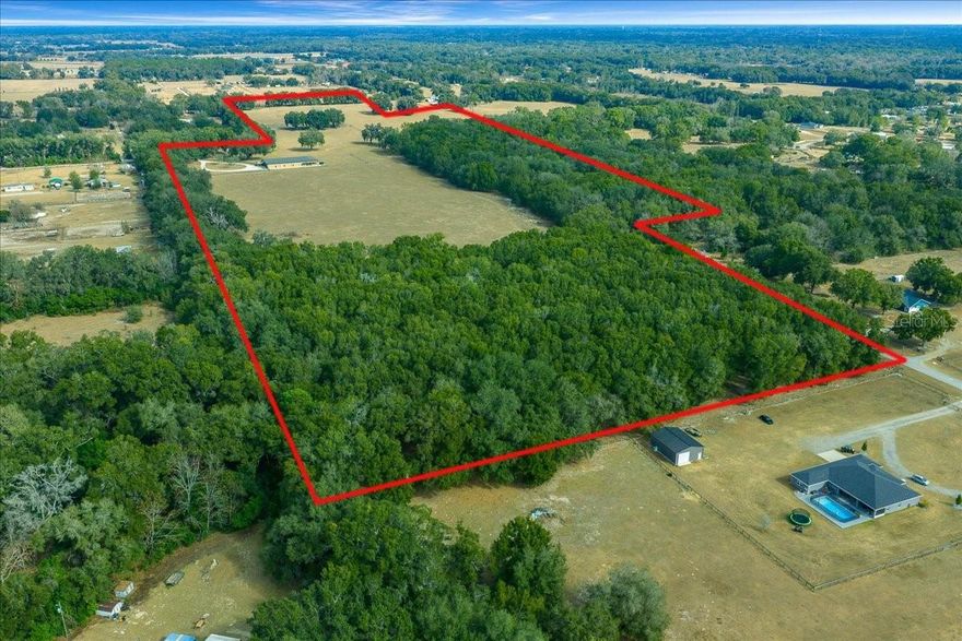 Exceptional opportunity to own 50± acres of fully fenced land in desirable Summerfield, Florida. Located just 30 minutes from the World Equestrian Center and minutes from I-75, this property offers both privacy and accessibility with close proximity to Belleview, Ocala, and The Villages. The land features a beautiful mix of open pasture and mature woods, making it ideal for agricultural, equestrian, recreational, or future development use. An impressive 80x140 barn is already in place, with well and electric available on site. Owner is willing to subdivide into smaller parcels pending county approval, offering flexibility for a variety of buyers and investment strategies. This is a rare large-acreage offering in a rapidly growing area. 

Additional 25± acre parcel available for purchase (MLS #OM717965). Don’t miss this chance to secure usable land in one of Marion County’s most sought-after locations. Call today to see this hidden gem.