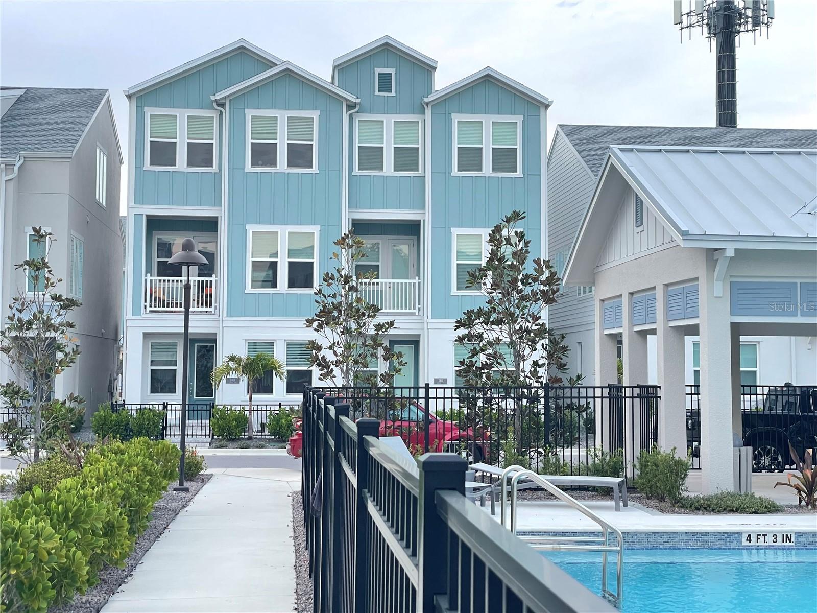 ANNUAL UNFURNISHED 3-bedroom, 3.5-bathroom townhome ideally located near Downtown Sarasota! This sleek, luxury residence boasts an open floor plan, soaring ceilings, and abundant natural light throughout. The main level features an expansive kitchen with solid wood cabinetry, solid surface countertops, a breakfast bar island, a walk-in pantry, and stainless steel appliances. The adjacent dining and living areas allows for family and guests entertainment with easy access to a convenient half-bathroom. Upstairs, the spacious master suite includes a luxurious en-suite bathroom with dual sinks, a walk-in shower, a water closet, and a generously sized walk-in closet. The second bedroom on this floor also features a walk-in closet and a private attached bathroom. A conveniently located laundry room completes the upper level. The third bedroom, with its own closet and bathroom, is situated on the ground floor. Enjoy the convenience of a 2-car attached rear garage and a welcoming front porch overlooking the resort-style heated pool and spa with open and covered lounging areas. Payne Park Village offers exceptional proximity to shopping, dining, entertainment, and the Legacy Trail, which begins across the street and extends 18 miles to Venice. Directly across the street, Payne Park provides 29 acres of recreational amenities, including 12 Har-Tru tennis courts, horseshoe pits, an auditorium, a skate park, a circus-themed playground, and walking/running/skating trails. Don't miss this exceptional rental opportunity – call today for a showing!NOTE: This community is governed by a homeowners association. Approval may include an application, background screening, fees, and an approval process. Contact the agent for details.