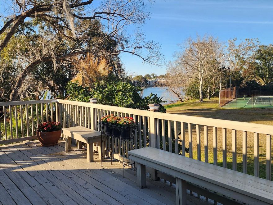 LAKE VIEW LIVING AWAITS YOU!!  Welcome to the charming, gated community of Oak Harbour!  This Highly sought after 3-bedroom, 2 bath with main floor bedroom and spectacular views of Lake Orienta from both the first and second floors!  The massive upstairs deck has room for enjoying your morning coffee, sunning privately during the day, evening dinners, or entertaining. This condo has an open floor plan with tons of spacious living area and an additional flex space for office, den, or studio. Amazing high soaring ceilings.  Upgrades include beautiful hardwood cabinetry and stone countertops.  Thermal windows, high-grade luxury flooring, plantation shutters and ceiling fans throughout. Main floor enclosed porch with large windows across the back feature more of the beautiful lake view. You can take a stroll down the Oak canopied streets, meander to the Lake and walk out to the beautiful, covered dock.  Your 2nd floor oversized private deck/balcony is the perfect place for watching the Cranes Roost 4th of July fireworks over Lake Orienta or the beautiful nightly sunsets!  Within the community you will find the newly renovated club house, fitness center and sauna.  In addition, there are many other amenities at your fingertips.  You have access to two beautiful community pool areas, tennis courts, pickle ball, shuffleboard, monthly activities, club house with outdoor grilling area, lake access, gated community, and a short distance away from Uptown Altamonte and downtown Maitland.  There is nearby shopping, restaurants, churches, hospitals, and close proximity to the beaches. A perfect place to call home. This is absolutely move in ready and a must see!