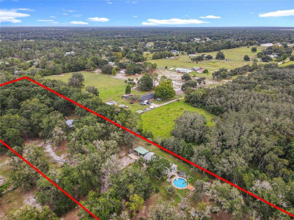 Photo of 22850 Winterwillow Lane, Eustis, FL 32736 (MLS # O6348021)