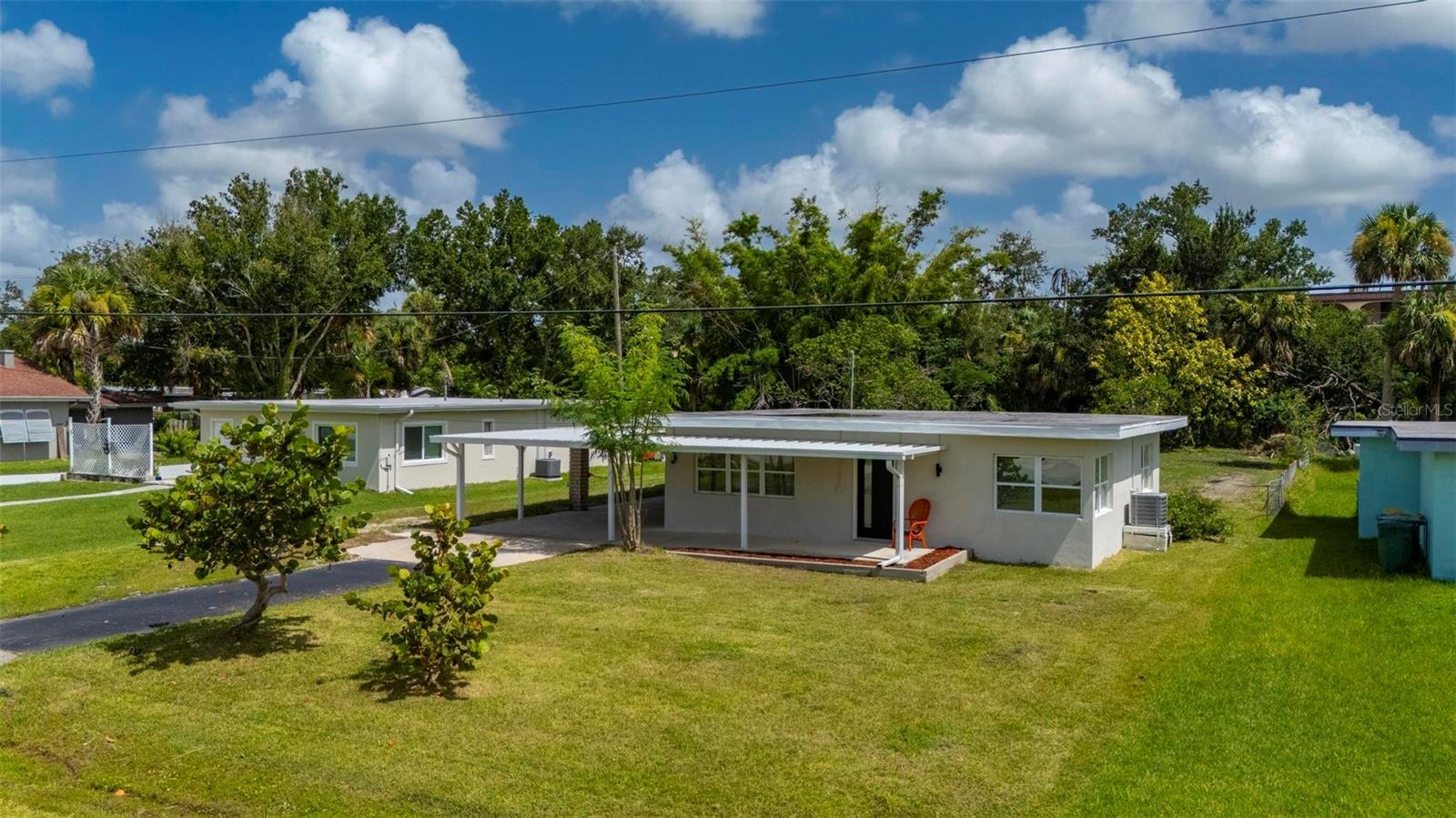 One or more photo(s) has been virtually staged. Welcome to 23472 Harper Ave, a charming slice of Old Florida located just 5 minutes from historic downtown Punta Gorda. This beautifully renovated 3-bedroom, 1-bathroom home blends classic character with modern updates. Inside, you'll find brand NEW TILE FLOORING throughout, a completely REMODELED KITCHEN with soft-close WOOD CABINETRY, STAINLESS STEEL and elegant STONE COUNTERTOPS, and a sleek NEW BATHROOM featuring a spacious walk-in shower. A large Great Room Additional upgrades include NEW A/C system 2025 & under warranty, and a new water heater.
Situated on an OVERSIZED 15,000 sqft LOT, there's plenty of space for outdoor living, gardening, or future additions. The home is located in a quiet neighborhood close to the Peace River, with a public boat ramp just minutes away—perfect for enjoying Southwest Florida’s boating lifestyle. Nearby parks and attractions includes Port Charlotte Beach Park, Fishermen’s Village, Englewood beach, & Boca Grande offering everything from waterfront dining to shopping and community events. Whether you're a first-time buyer, seasonal resident, or investor, this home offers exceptional value in a prime location. Don’t miss this opportunity to own a piece of Florida paradise!