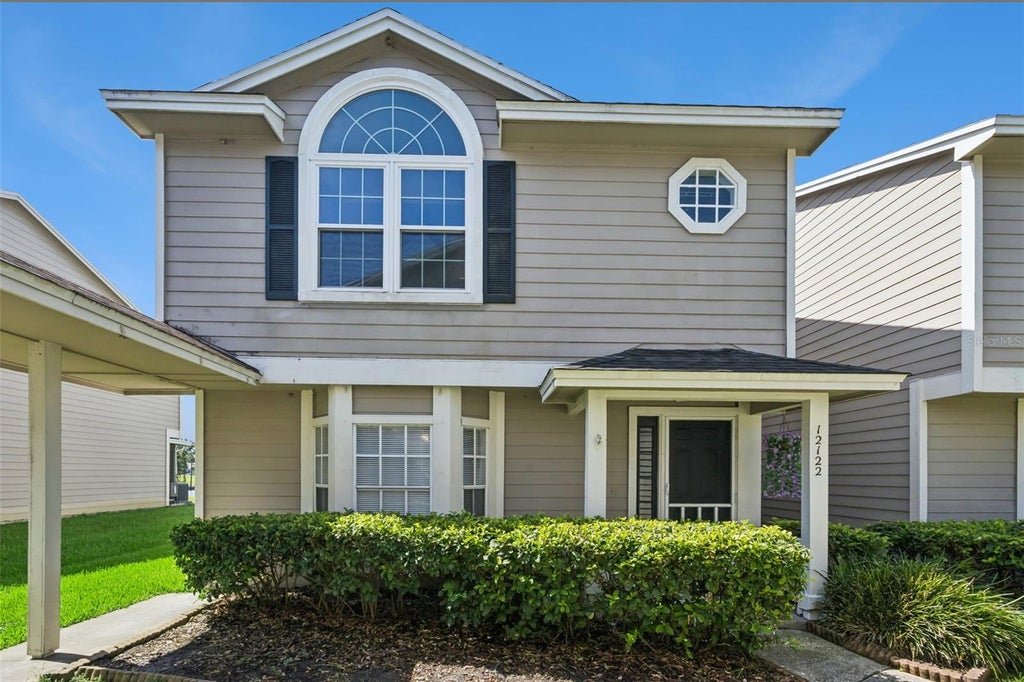 Photo of 12122 Bruceton Way #103, Orlando, FL 32828 (MLS # O6418237)