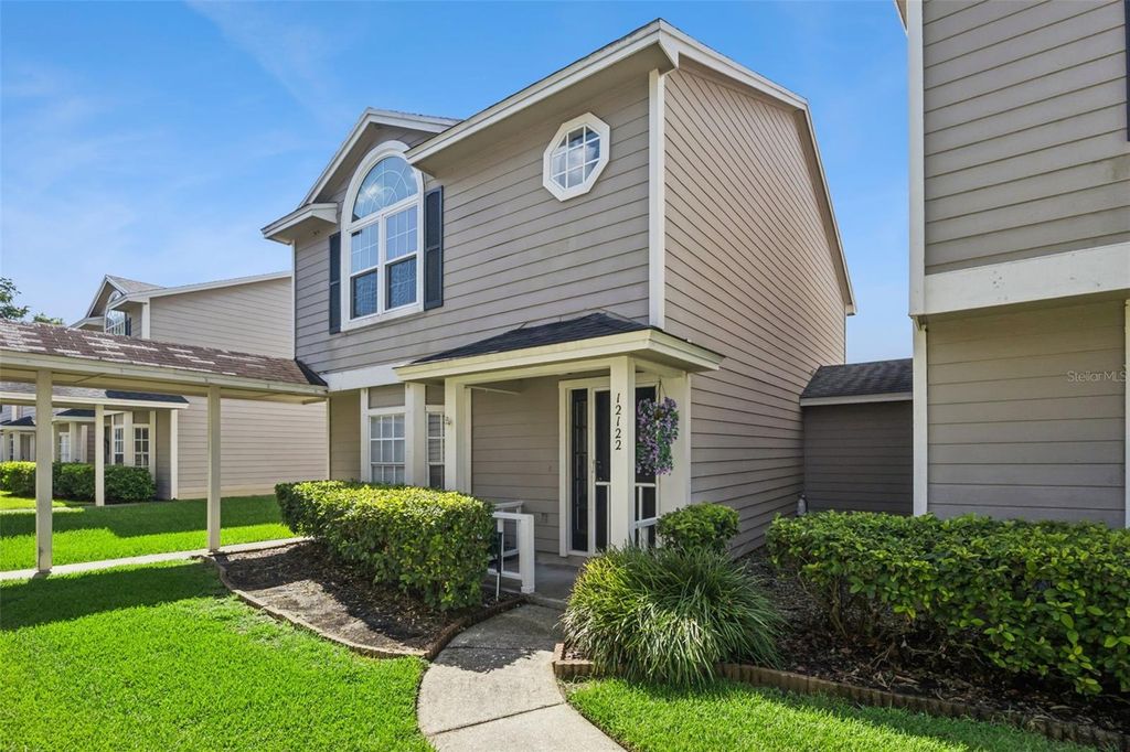 Photo of 12122 Bruceton Way #103, Orlando, FL 32828 (MLS # O6418237)