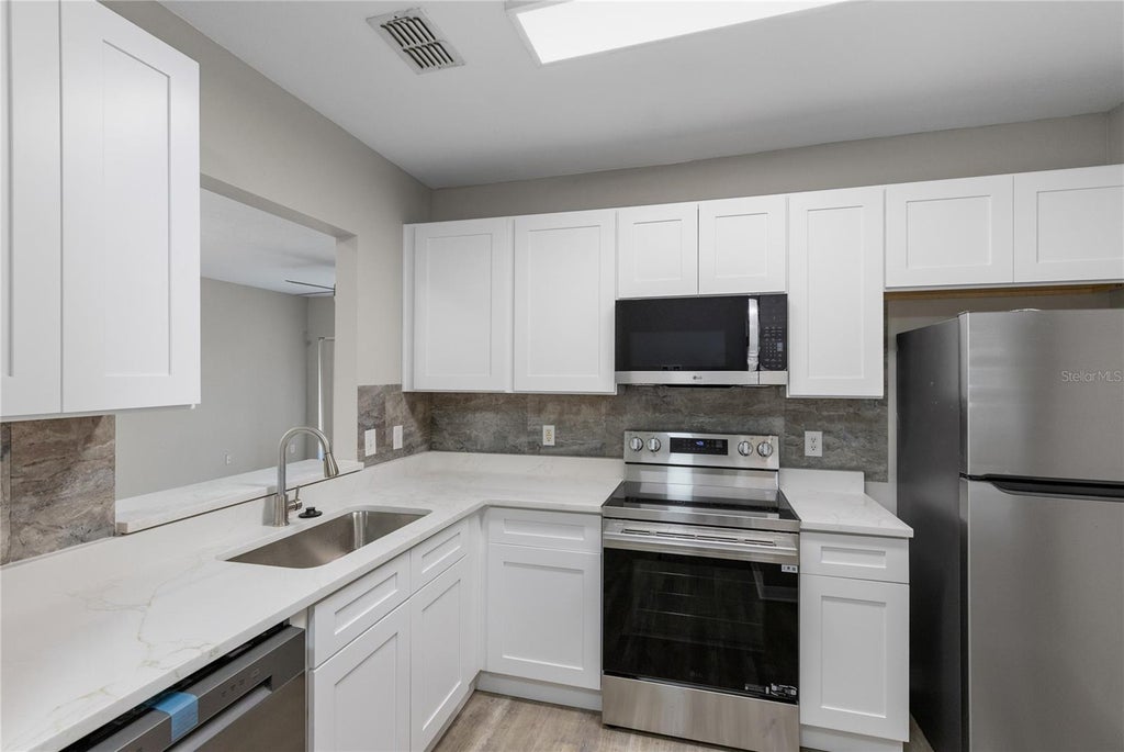 Photo of 522 Villa Del Sol Circle #201, Orlando, FL 32824 (MLS # O6414354)