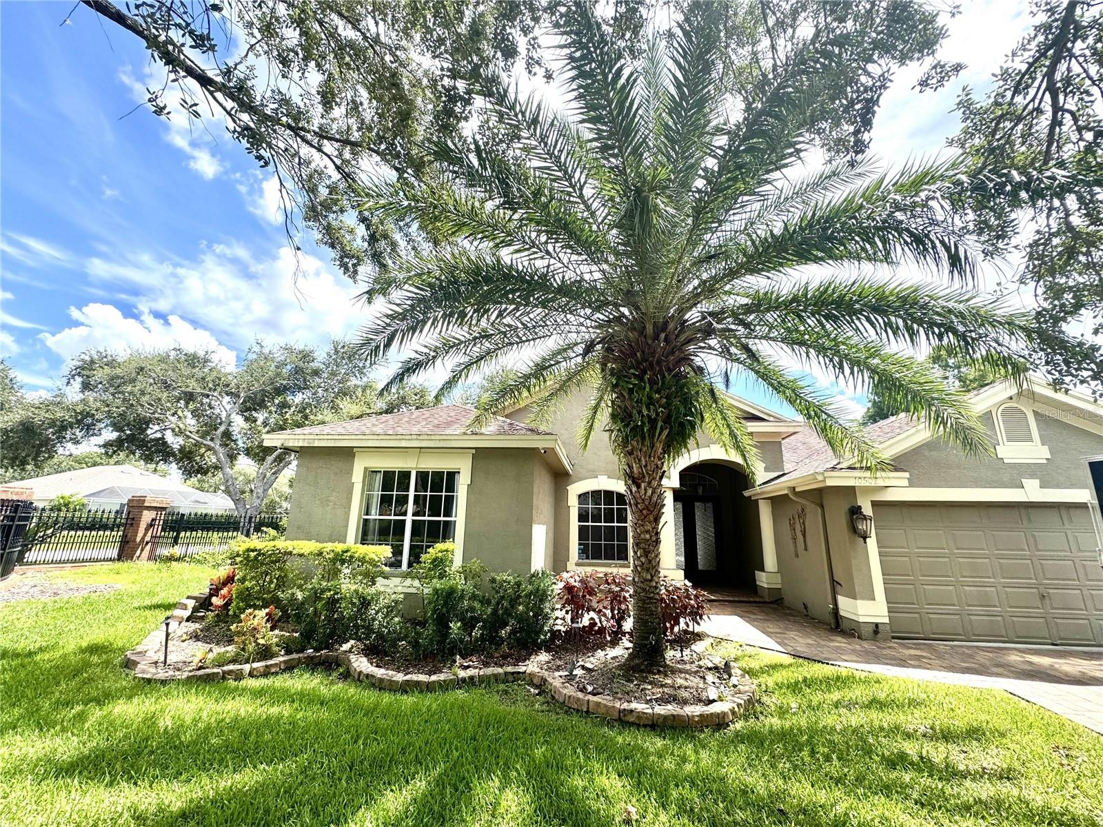 Welcome to this stunning, Beautifully Remodeled 3BR/3BA (+ Bonus Room) and Pool single-story home located in the desirable Westchase community only 1 mile from Westchase Village! This spacious home boasts 2557 sq ft of elegant living space with luxury finishes throughout. Step into a sunlit, open concept living space where modern elegance meets warmth and functionality. The Kitchen & Family Room provide casual elegance coupled with modern conveniences. The fully remodeled kitchen showcases crisp white shaker cabinetry, brand-new stainless-steel appliances, a natural gas cooktop, and sleek quartz countertops, including a center island ideal for casual dining or entertaining. Overlooking the kitchen, the spacious family room is anchored by a stunning stacked-stone fireplace, flanked by high transom windows which frame serene views and flood the space with natural light. Wide-plank wood flooring, pendant lighting, and a ceiling fan complete this inviting area, perfect for both relaxing nights in and hosting gatherings. The living and dining also have wooden floors and overlook the serene pool and covered deck area. There is a bathroom with access to the pool area in addition to the Primary bath and the Guest Hall bath. The screen enclosure keeps everyone protected while they are using the deck and pool areas. The Primary Bedroom is large enough for a king-size bed and has a roomy walk-in closet. The Spa-style primary bathroom retreat has dual vanities, a soaking tub, a frameless glass shower, and designer tile, along with a luxury bidet commode. The Hall Guest bedroom has been updated with a modern vanity, modern wall tile, and luxury flooring. In addition to the 3 bedrooms, there is also a flexible space which would be perfect as a Home Office or 4th bedroom. There is a separate laundry room with new appliances, and the dryer is natural gas. The attached Large 3-car garage offers extra storage and convenience, including a natural gas water heater. Westchase Community Amenities: - Tennis courts, parks, playgrounds, and walking trails - Golf courses and village centers nearby - Close to A-rated schools Prime Location: - 20 minutes to Tampa International Airport - 30 minutes to downtown Tampa and Gulf Coast beaches - Easy access to shopping, dining, and major highways.