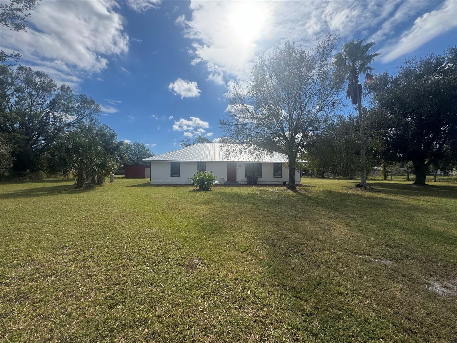 Clean, maintained and spacious 5 bedroom, 2 bathroom home situated on over an acre of land! This home is located in a central area in between state road 70 and state road 72 with quick access to the city of Arcadia, Sarasota, Lakewood Ranch, Myakka city, Port Charlotte and Punta Gorda all within 10-45 minutes. Let's talk interior features, the kitchen affords you with plenty of room to cook and entertain. It also offers granite countertops and newer appliances! The home was mechanically updated in 2023 with all new A/C unit, water heater and metal roof! The giant oversized lot on over 1 acre is completely fenced and has a large storage building/ shop to store tools and equipment! There are not many 5 bedroom homes around, come check this one out! PSA- The current owner is also interested in the possibility of owner financing, renting or doing a lease to own!