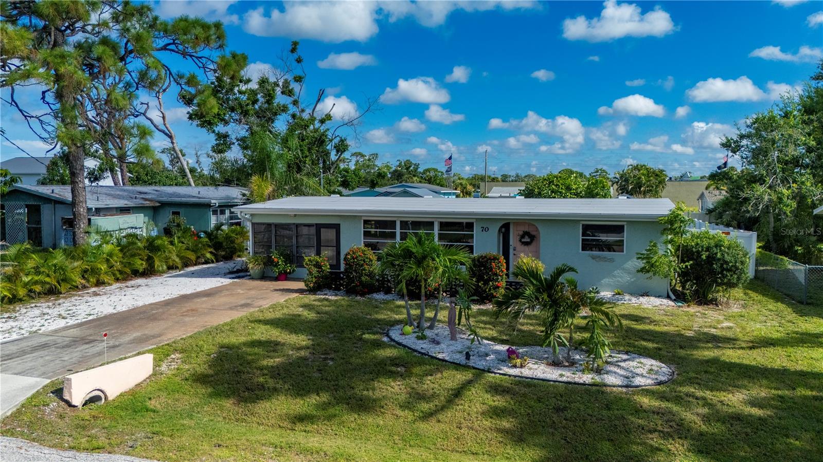 COASTAL BUNGALOW JUST 2 MILES TO MANASOTA KEY!
This light & bright 2BR/1.5BA home captures the charm of Old Florida with a welcoming, sunny interior and a bank of windows that fill the home with natural light. Less than a mile to Indian Mound Park, where you can launch a boat, fish from the pier, or enjoy Lemon Bay views. Just off the main living area, this home offers an eat-in kitchen with SOLID SURFACE COUNTERS, STAINLESS APPLIANCES & vaulted ceilings. Bedrooms are spacious and inviting, while both bathrooms are tastefully updated, including the newly added half bath. You’ll love the indoor laundry room, sunny Florida room, and unique touches that make this home truly special.
Outside, enjoy your privacy with the LARGE VINYL FENCED YARD with a new concrete patio, sail shade & fire pit. Located in an X FLOOD ZONE for lower flood risk, with NO FLOODING history. Energy-efficient mini-splits, and a electric powered STORAGE SHED/SHE SHED add convenience. Plenty of extra driveway space parking for boat or RV. Close to beaches, marinas, golf & dining – your Florida lifestyle awaits!