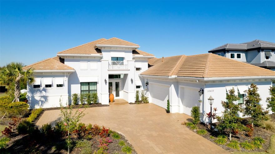 This breathtaking residence is one that truly stands out from the rest. This home exhibits unsurpassed perfection in design and detail. From the moment you enter the double doors, you are welcomed with a spacious and inviting floor plan. Boasting almost 4,000 square feet under air featuring a bright and inviting interior with no detail overlooked. Enjoy the sleek and modern design of every room beginning with the open kitchen, highlighted by the solid wood cabinets, two oversized island spaces, quartz counters, stainless steel appliances, pull out cooling and warming drawers, wine cooler, soft-close drawers and cabinet doors complete the quality finishes in the kitchen. Expansive great room with soaring custom ceilings and crown molding. Truly seamless indoor-outdoor living is offered with pocket sliders in the great room and disappearing sliders in the dining room, both leading to the covered lanai with fireplace. This home has 4 bedrooms all of which have their own full en suite bathrooms. A separate office/den plus an oversized bonus room. Master bedroom is a breathtaking space with high tray ceilings with molding, double doors leading out to your own private pool and spa. Master bathroom is the epitome of luxury with a separate vanities and oversized walk in shower and free standing tub. The expansive outdoor living space includes a custom outdoor kitchen with huge island and built in grill. Enjoy your very own private and custom, heated saltwater pool/spa with water feature overlooking the peaceful and serene landscaped area. Lakewood Ranch has been ranked as one of the best-selling master-planned communities in the nation. Live, work and play in elegance, style and serenity. With an exceptional location, in a sought-after area of Country Club East in Lakewood Ranch, this active, gated neighborhood is a desired choice with the resident only amenity of the Retreat with lap pool and fitness center. Country Club East in Lakewood Ranch is a gated golf community, with several levels of optional Golf and Country Club memberships, including 2 golf courses with world-class practice facilities. Close proximity to great restaurants, golf courses, University Town Center Mall, local shops, Lakewood Ranch Main Street, and a short drive to Downtown Sarasota, St Armands Circle, and our World Famous Siesta Key Beach. Every convenience, just a few miles away! Paradise awaits!