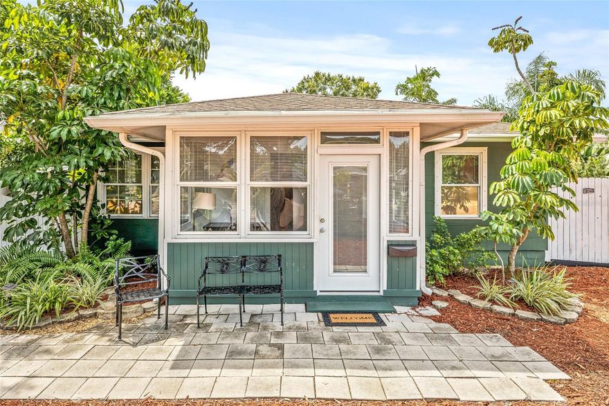 Darling vintage appeal with modern touches in this mid-century charmer in St Pete! Built in 1952 and set on a generous nearly quarter acre lot, this gem blends original charm with smart upgrades. An enclosed front porch and back sunroom with mini-split were added in 2017 for extra living space. Potential to convert the sunroom into a primary suite with a bathroom to make it a 3 bedroom, 2 bathroom home! The bright eat-in kitchen opens to a lush backyard shaded by mature shade and palm trees. Tile flooring flows throughout for stylish durability. New composition roof installed in 2019. Ample parking with over­sized carport, motor home outlet, 50-amp panel, plus a back alleyway with gate access to the backyard - a unique feature that many homes in the area don’t have! Enjoy a workshop/potting shed with electricity, and an additional storage shed, both built on concrete pads. Enjoy entertaining with the lush landscaping and a mini outdoor kitchen area. Located with back alley access and yards of room for boats, RVs, or big summer setups. This location is high and dry in flood zone X and no flood insurance required! Located 6 miles to St Pete beach, 5 miles to downtown, .5 mile to nearest SunRunner stop and 1.5 miles to Tyrone Square Mall. Public Jungle Prada de Narvaez Park Boat Ramp only 2 miles away. Don’t just buy a home—own your Florida lifestyle upgrade!