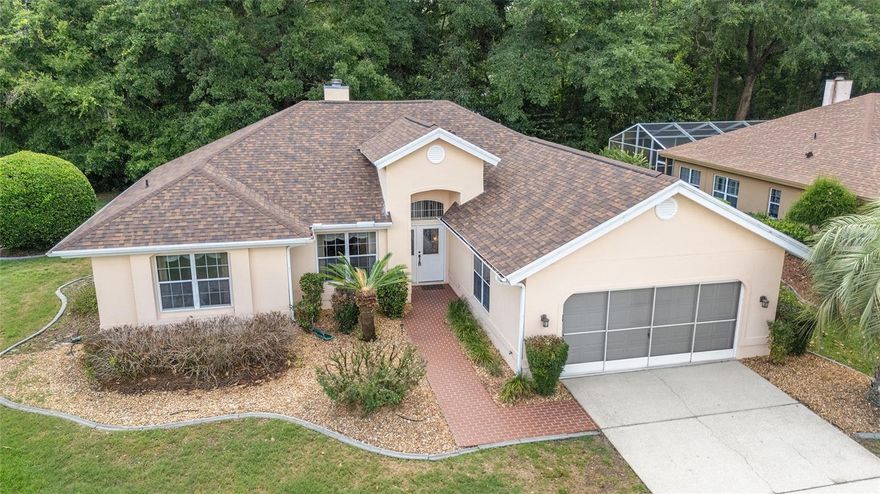 A brick walkway welcomes you into this Spacious and well maintained 2/2/2 Seville Model Home plus den. This 1656 sq ft home,is located in the Woodside Tract neighborhood in Oak Run Community, that is located close to the Island Club Pool! Two Lanais are enclosed,one with acrylic slider windows,the other off Primary Suite, has glass sliders. This split floor plan home has vaulted ceilings in the dining room/living room. No need to worry about carpet in home, there are wood floors and tile throughout. The living room features a real working fireplace. The Kitchen has a breakfast nook and lots of cabinets for storage. French doors open to the Primary Bedroom that has a walk-in closet and ensuite. The other Bedroom,Bath,and Den are on the other side of the home. New ROOF installed 2026. NEW Electrical Panel 2025. NEW Heating and AC installed 2024. This well maintained home has plenty of natural light. Oak Run is a 55+ gated community, with 6 pools, 5 spas, 2 fitness centers, Billiards and Card Room, Dog Park, Resturant, Golf Course and Driving Range. Close to Medical Facilities, Resturants and shopping.