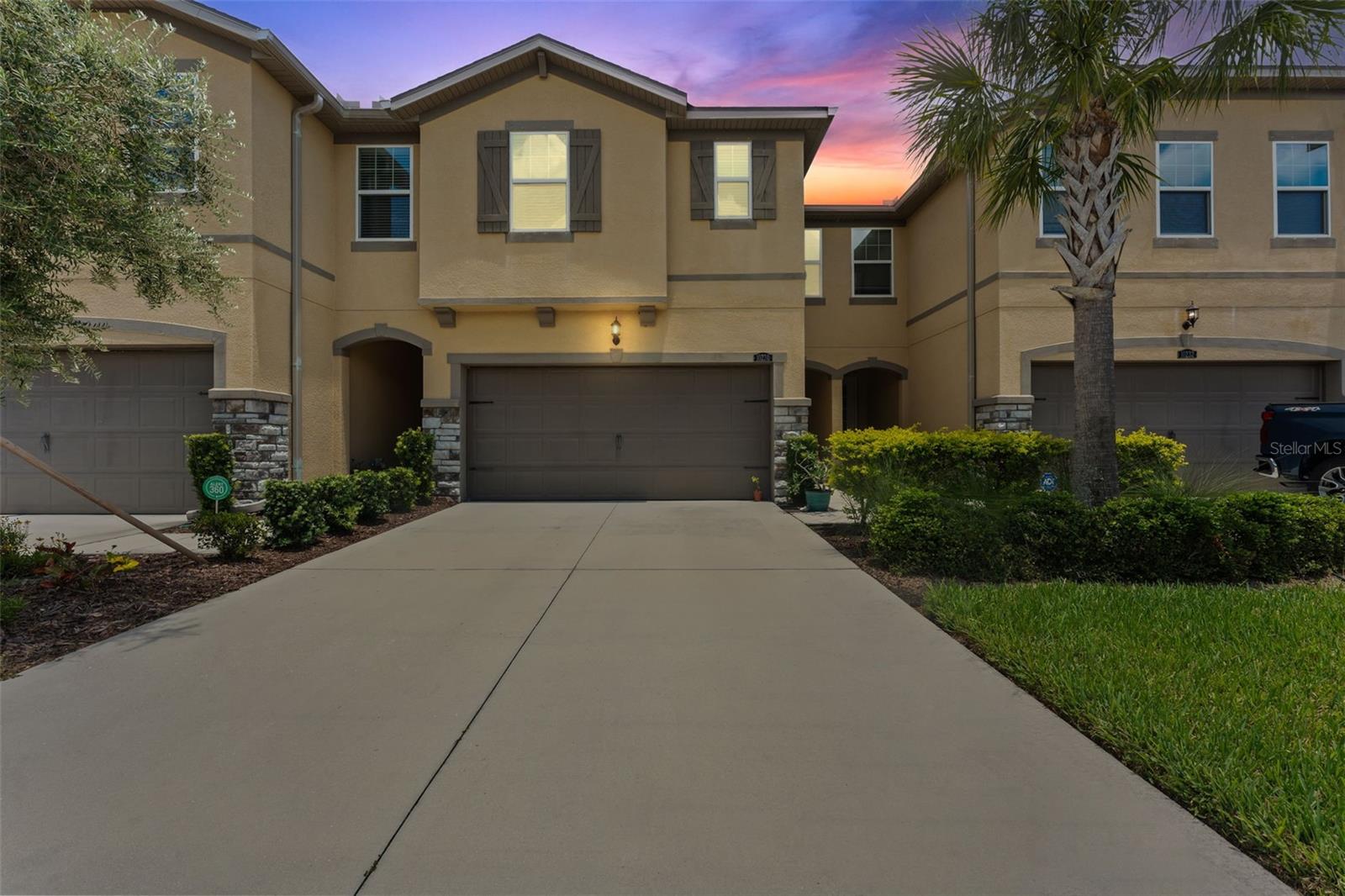 Enjoy stress free living with this thoughtfully designed townhome featuring NO BACKYARD neighbors and a pond view. Nestled in a gated Riverview neighborhood is where you will find this 3-bedroom, 2.5 bath, 2 car garage townhome with over 2300 sq. feet of comfortable and stylish living space. Stone accents, lush landscaping, decorator shutters and a covered porch are just some of the welcoming touches that adorn the outside of the home. The first floor consists of a beautiful open kitchen complete with solid surface counter tops, designer lighting fixtures, 42in cabinets, stainless appliances, walk-in pantry and large island with breakfast bar. The kitchen opens to the dining room and great room, the perfect space for spending time with family and friends and entertaining guests. There is a half bath downstairs as well as a spacious mud room with shelving. Upstairs you find the owner’s suite, a peaceful retreat that features a beautiful trey ceiling, large windows and 2 generous walk-in closets. You will find a large walk-in shower, solid surface counter tops with dual sinks and more within the private owner’s bath. Two secondary bedrooms, walk-in closets, a full bath with dual sinks and a large loft finish out the second floor. The fully screened and expansive lanai is located off the great room and is the perfect spot to enjoy your coffee in the morning as the sun comes up or having a cool drink under the summer stars. Whatever way you choose to enjoy this space, having no backyard neighbors and a view of the lush Florida landscape will soon make this lanai your favorite spot to relax. Community amenities include a dog park, play park, resort style community pool, exterior maintenance, landscaping, irrigation and more! This amazing community is located close to shops, restaurants, hospitals and I-75 for easy access to Tampa. Don't miss this opportunity to own this amazing townhome, call to schedule your private showing today.