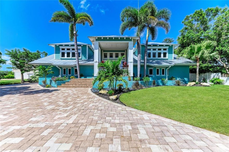 Paradise Found in Cape Haze!

This majestic two-story luxury waterfront estate embodies the very best of Florida living, combining timeless design with exceptional upgrades and direct access to the Gulf of America. With 5 spacious bedrooms, 4 full bathrooms, a private elevator, and an expansive resort-style pool and spa, this home is as functional as it is breathtaking.

From the moment you arrive, the curb appeal captivates with mature tropical landscaping with 3 wells on site, a circular drive, new pavers, and a welcoming entry. At the water’s edge, a brand-new tiki hut and lounge area create the perfect private retreat for sunset gatherings, overlooking the wide canal with a small island beyond the dock that provides privacy from houses across the canal.

Step inside to soaring vaulted ceilings, French doors, and walls of glass that flood the home with natural light and frame panoramic water views. The main living level offers an open-concept design blending elegance with comfort: a great room with custom built-ins and fireplace, a gourmet kitchen with Cambria quartz counters, premium appliances including LG refrigerator and two-drawer dishwasher, upgraded cabinetry, and a glass-railed covered porch for year-round indoor/outdoor living. Off the porch is a spiral staircase to the Crow's Nest with 360 views of the nearby Intercoastal waterway, Gulf, and Boca Bridge.

The primary suite is a sanctuary of luxury with balcony access, dual walk-in closets, and a spa-style bath featuring soaking tub, glass shower, and dual vanities. Also off the living room is a guest bedroom with built in murphy bed and en suite bathroom. Just past the kitchen, the 2nd guest bedroom with beautiful faux paint and extra space for relaxing is ideal and the 3rd guest bedroom has a built-in murphy bed and doubles as an office with access to the lanai. Also on this side of the home is the large laundry room and shared guest bathroom.

The lower level expands the lifestyle with a 38’ x 27’ bonus room opening to the pool, a full bath, a large guest suite with den/walk-in closet, a 3-car garage, and dedicated workshop/storage areas—perfect for entertaining, hobbies, or multi-generational living.

Recent upgrades ensure peace of mind and modern convenience: new pavers, new panoramic two-story pool cage, new Pentair pool heater/motor/controls, new AC, new water heater, new LG & GE appliances, new lawn and landscaping, plantation shutters, designer lighting, hurricane protection, generator connection, and more.

Boaters will appreciate the deep-water canal with seawall, extended dock, two boat lifts, and a brand-new jet ski lift—all just 15 minutes to open Gulf waters via the Intracoastal.

As part of Cape Haze, residents also enjoy deeded beach access to Don Pedro Island, and an optional HOA with clubhouse, offering a rare combination of Gulf-front beach lifestyle and deep-water boating from your backyard.

Located minutes from world-class fishing, golf, fine dining, shopping, and set within golf cart-friendly streets, this home truly captures the essence of the Southwest Florida lifestyle.

Luxury. Lifestyle. Location. This home has it all. Be sure to view the full virtual tour for every detail.
