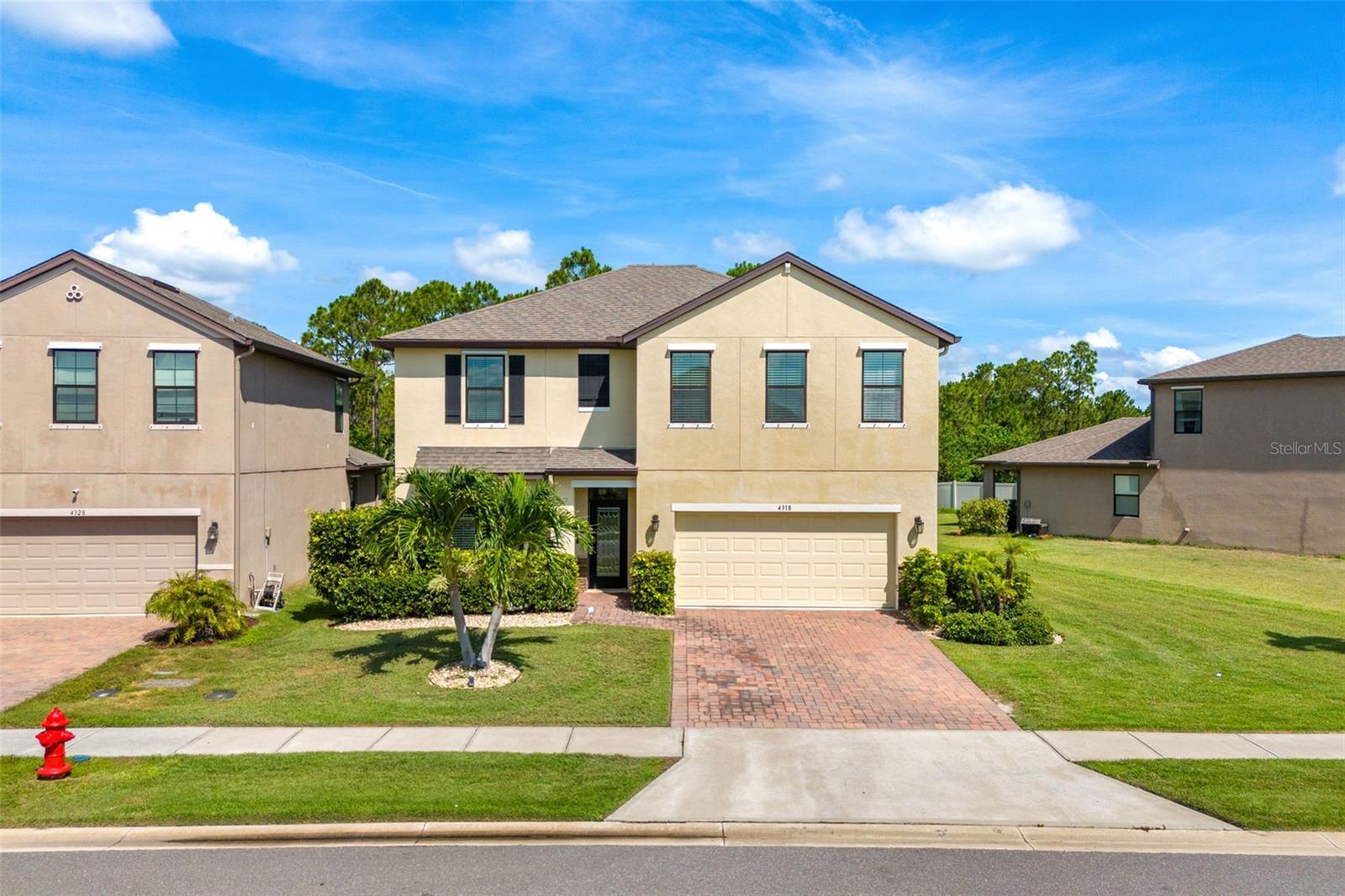 Welcome to this gorgeous 5-bedroom, 2.5-bath home in the sought-after, gated community of Sawgrass Lakes. From the moment you enter, a soaring two-story foyer and stylish accent wall set a welcoming tone. The spacious owner's retreat is tucked downstairs with a sitting area, walk-in closet, and private access to the covered patio. The ensuite bath features dual sinks, a walk-in shower, and a relaxing soaker tub. The bright, open kitchen offers a large island, stainless steel appliances, granite countertops, walk-in pantry, and breakfast bar—all overlooking the living and dining area filled with natural light and peaceful preserve views. Upstairs includes 4 bedrooms, a full bath, and a roomy loft. Enjoy resort-style amenities: lagoon pool, waterslide, splash park, clubhouse, gym, tennis, fire pit, and walking paths. Close to top-rated schools, major employers, and just 11 miles from the beach—this home blends comfort, convenience, and community. Schedule your tour today!