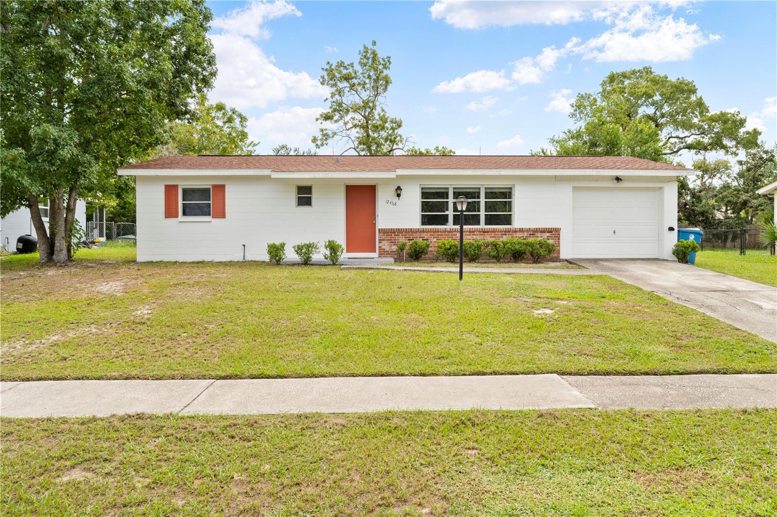 Welcome to 12468 Eddington Road, your PEACEFUL FLORIDA RETREAT! This inviting 2-BEDROOM, 1.5-BATH home with an ATTACHED 1-CAR GARAGE combines thoughtful updates with everyday comfort. Set in a quiet neighborhood with NO NEIGHBORS DIRECTLY ACROSS THE STREET, it offers a tranquil backdrop for full-time living or seasonal getaways. Step inside to a cozy living room perfect for relaxing after a long day, with a charming dining nook just off the kitchen — ideal for morning coffee or casual meals. The home comes complete with all appliances, so you can move right in and start enjoying it immediately. Both BATHROOMS HAVE BEEN BEAUTIFULLY REMODELED, with the full bath featuring a stylish tiled shower. The primary bedroom boasts its own half bath plus a generously sized WALK-IN CLOSET, providing plenty of space and privacy. Updates like NEW FLOORING, a NEWER WATER HEATER (2022), and a 2020 ROOF mean many big-ticket items are already taken care of. A sliding door opens to the SCREENED LANAI AND COVERED BACK PATIO, extending your living space outdoors. Whether you’re entertaining friends or soaking up the Florida sunshine, this home makes it easy to enjoy indoor-outdoor living year-round. PERFECT FOR A FIRST-TIME HOME BUYER or a SNOWBIRD seeking a humble RETREAT for the winter, 12468 Eddington Road blends charm, updates, and peace of mind. Homes like this don’t stay on the market long — schedule your showing today and discover your next chapter!